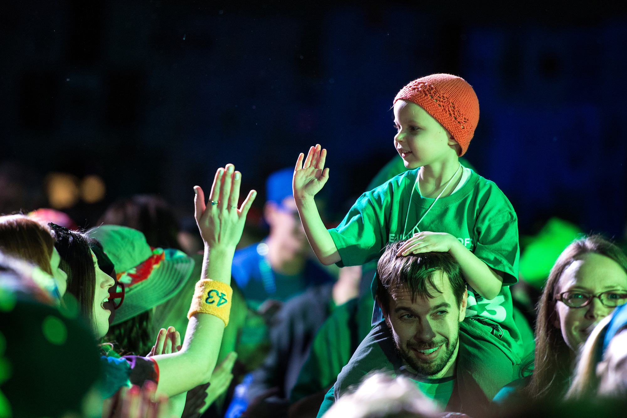 child giving high-five at dance marathon