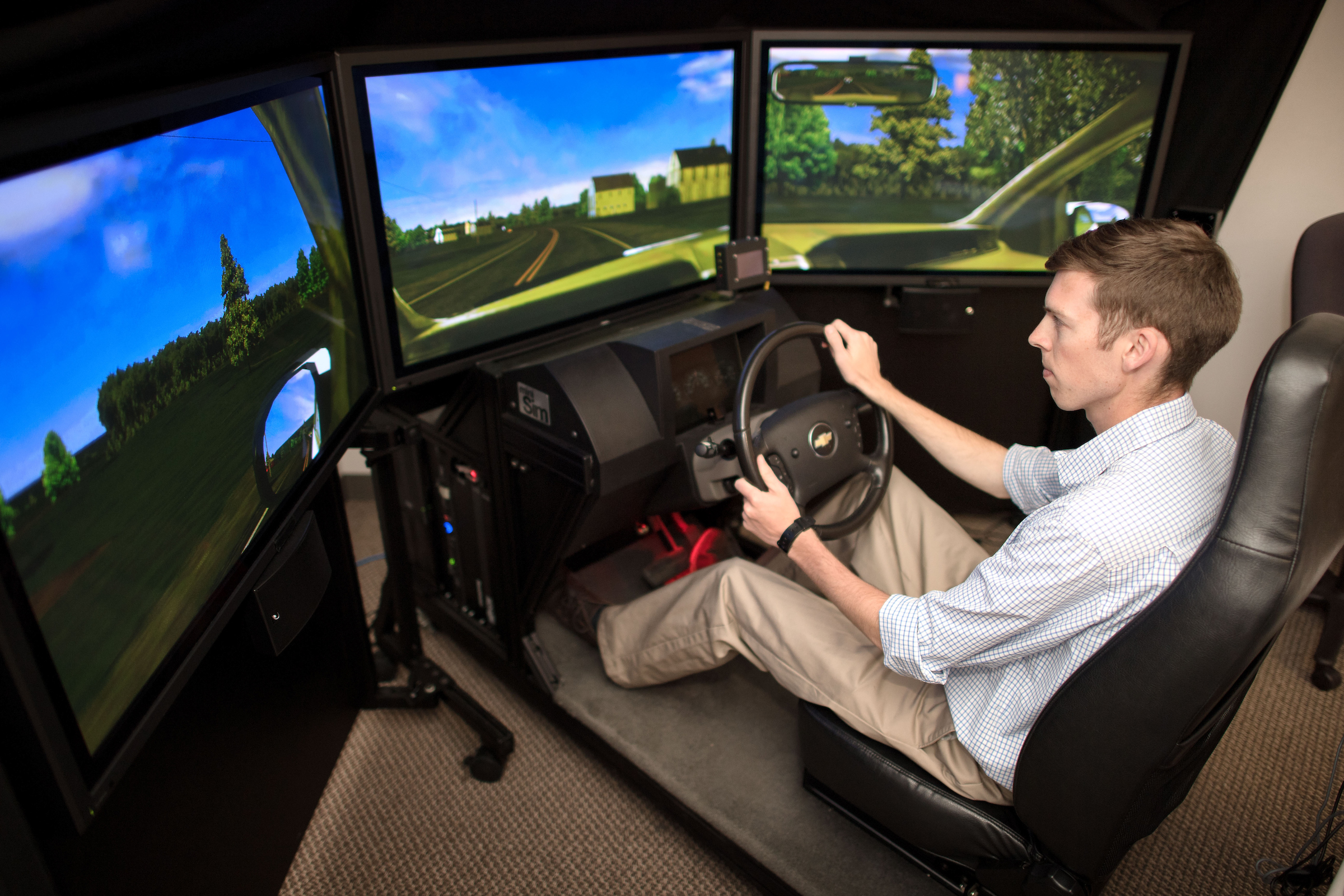 student working in driving simulator