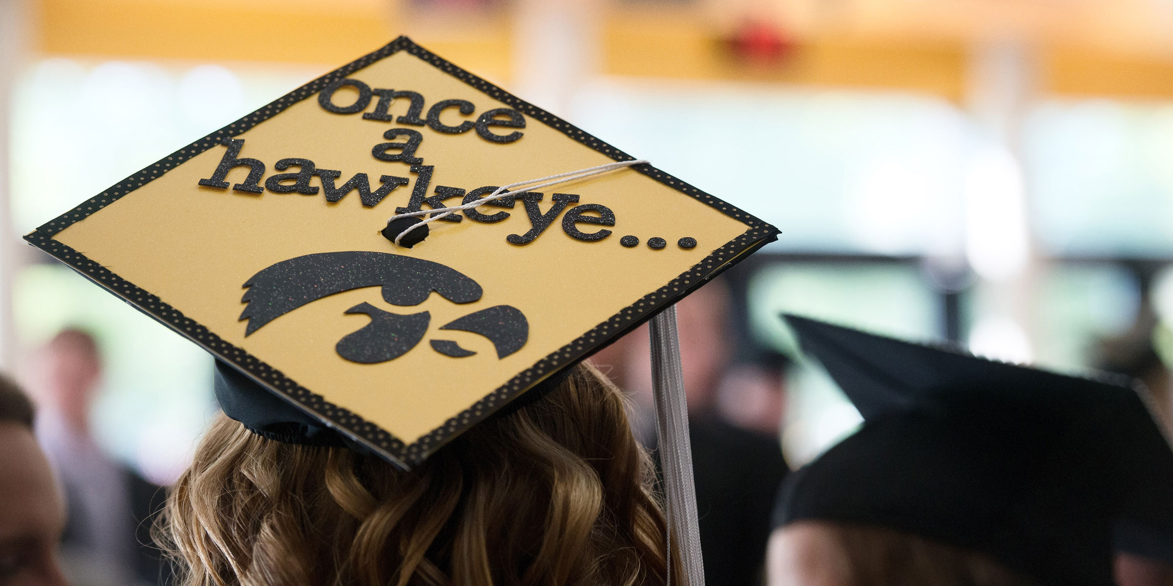 Decorated graduation cap with words "Once a Hawkeye..."