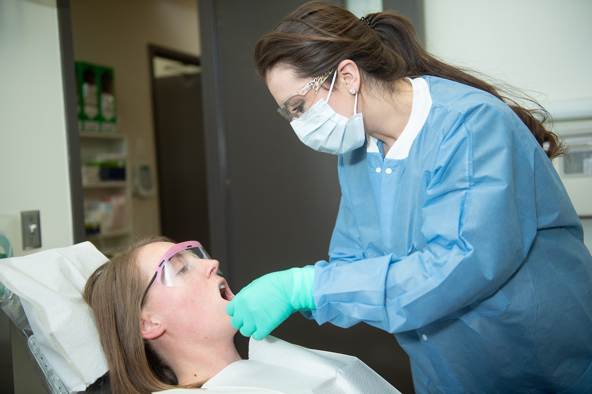 University of Iowa College of Dentistry student Briar Voy working in clinic