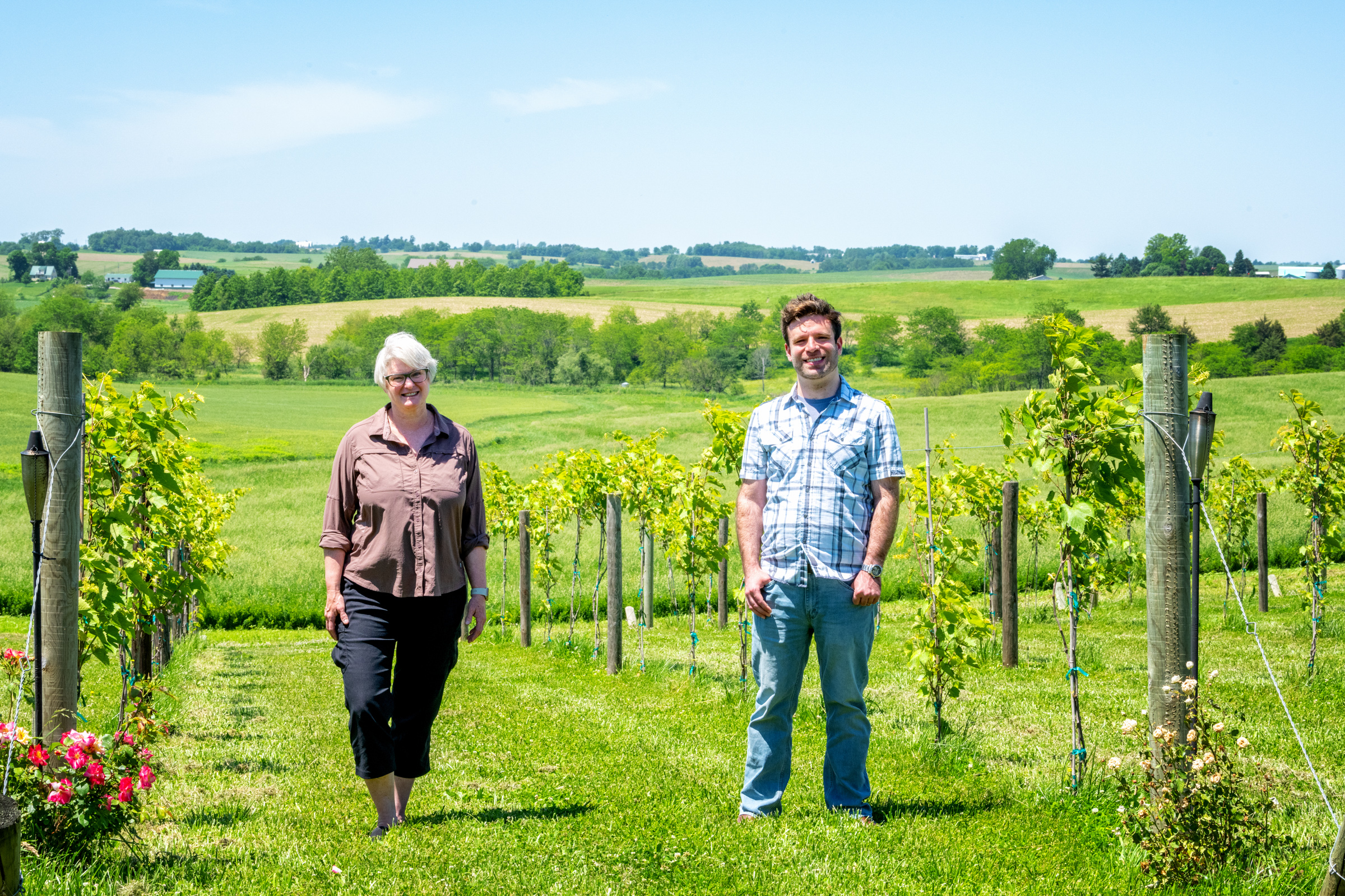 University of Iowa faculty member Kristy Walker and Iowa graduate student Matt Bare at a vineyard near Iowa City