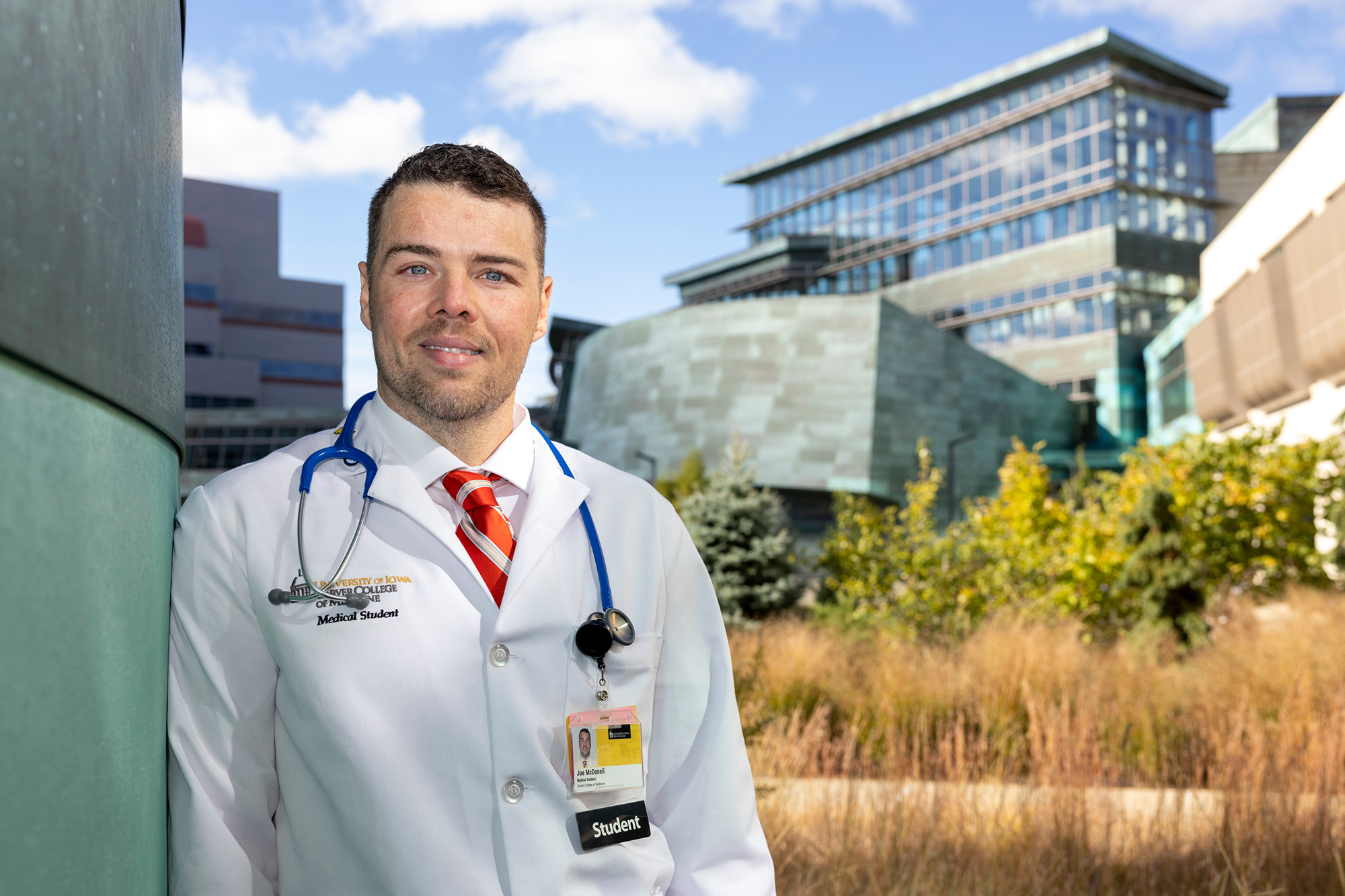 University of Iowa Carver College of Medicine student Joseph McDonell stands outside on the health care campus