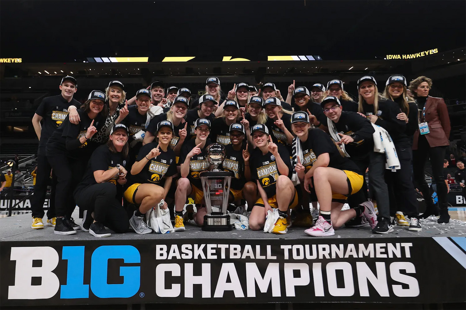 university of iowa women's basketball team posing for a team photo after winning the big ten conference basketball tournament