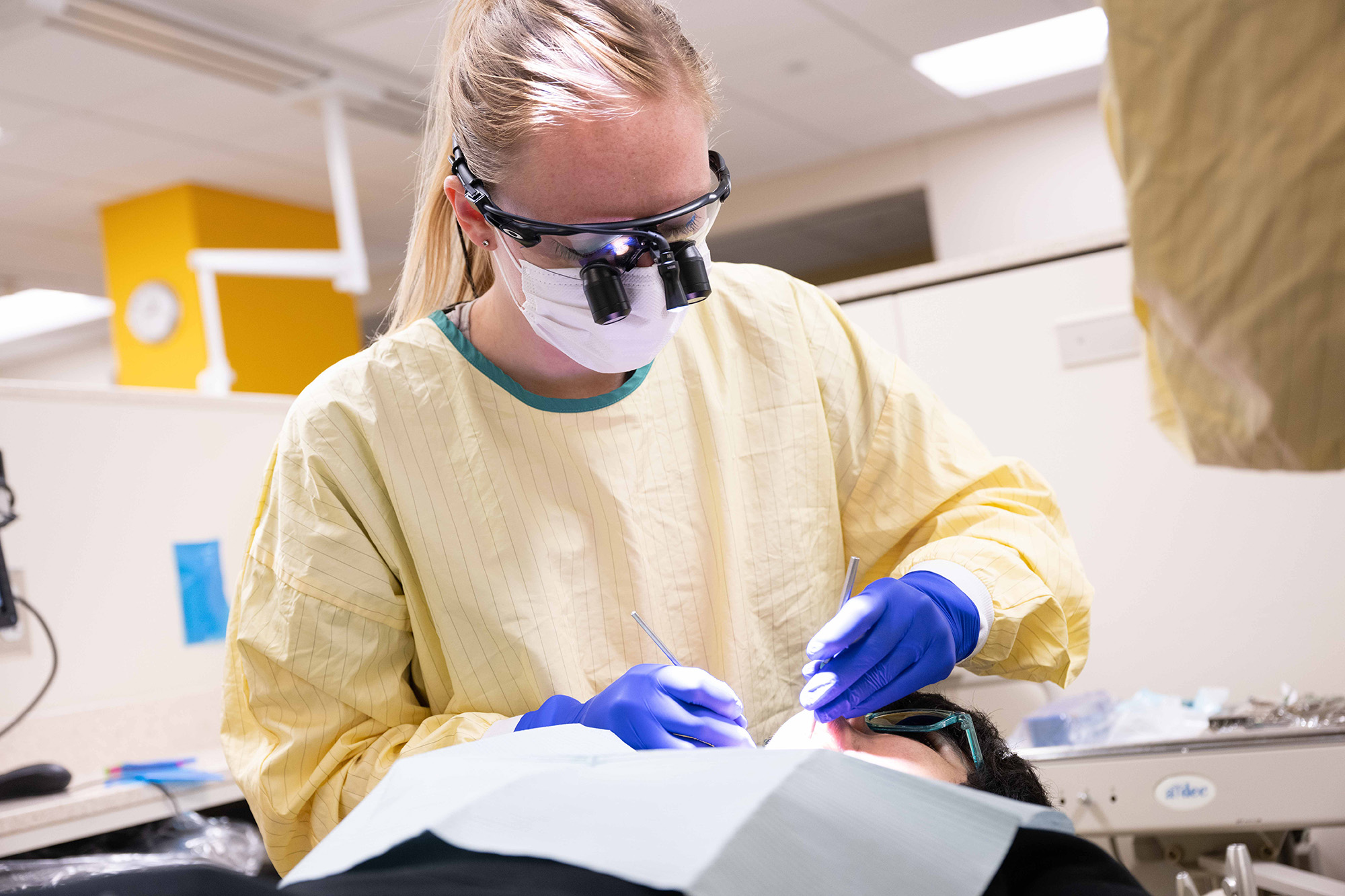 a woman working in a dental clinic