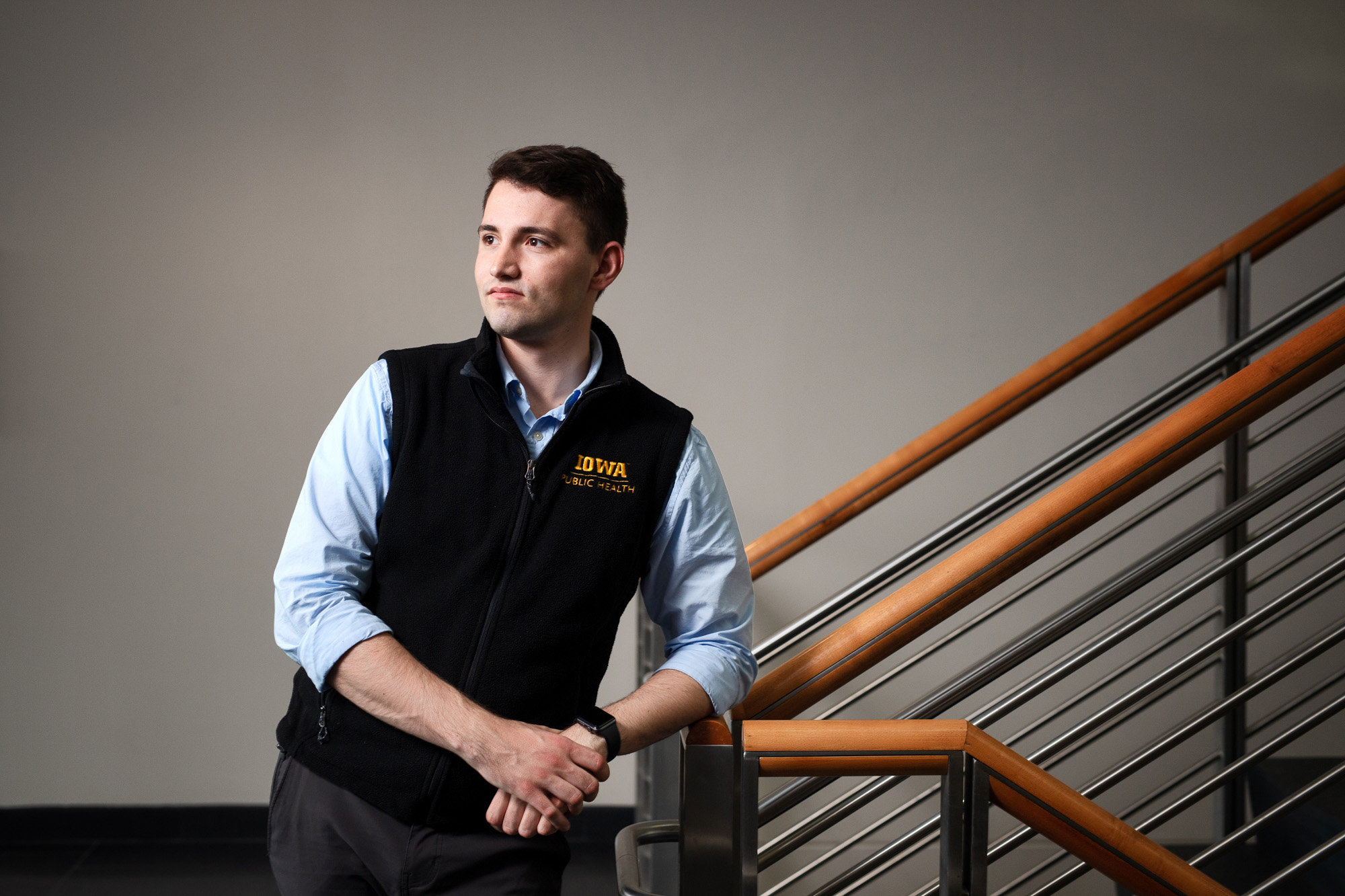 a young man standing in a stairwell