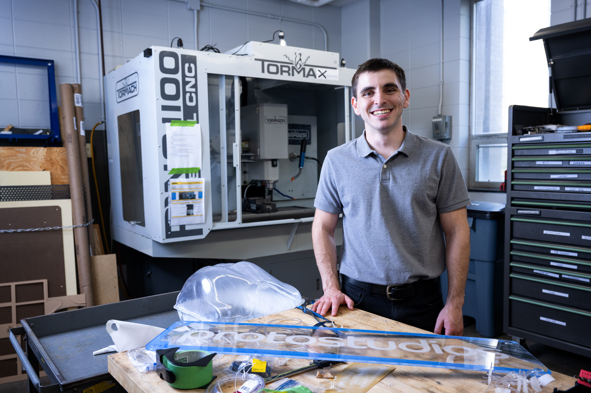 University of Iowa alumnus Max Swartz standing in one of the three Protostudios workspaces on campus