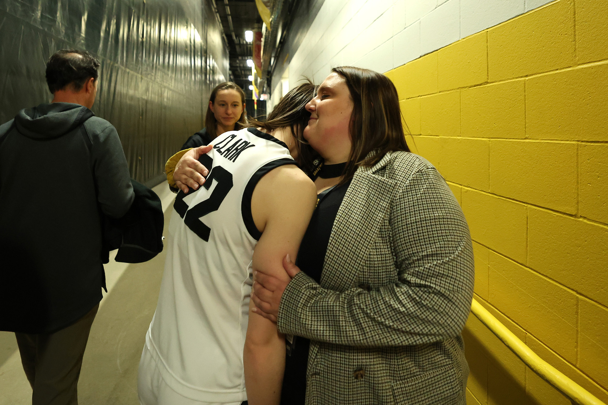 Brandee Britt embraces Caitlin Clark in the halls of Carver-Hawkeye Arena fter the Iowa Hawkeyes defeated the Indiana Hoosiers, 86-85