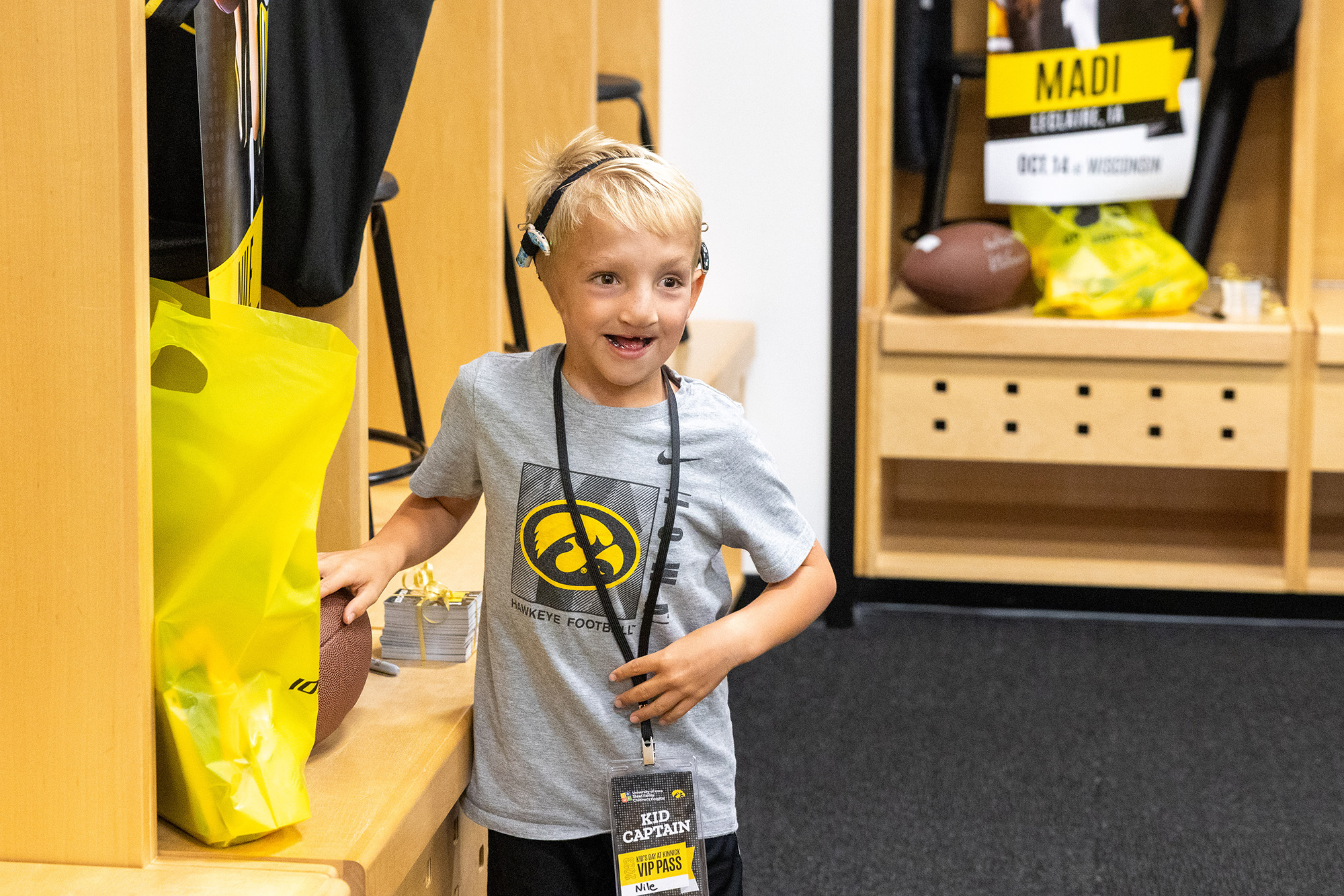 Kid Captain Nile Kron in the locker room at Kinnick Stadium