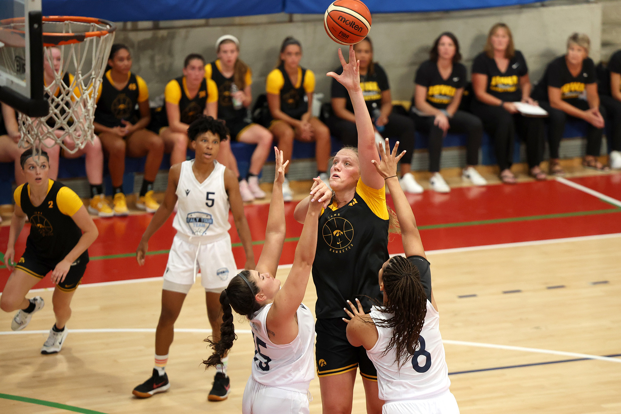 University of Iowa women's basketball player Sharon Goodman attempting a shot during a game in Europe