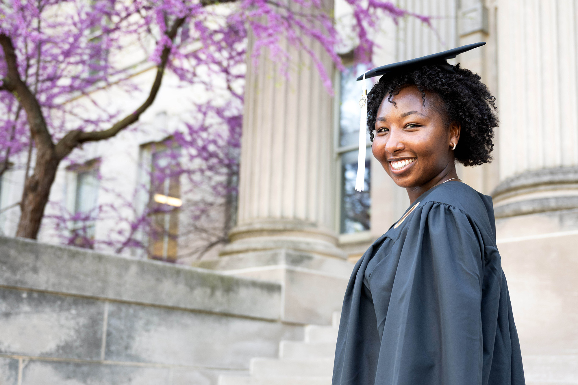 University of Iowa graduate Virginia Wangechi Muturi wearing cap and gown