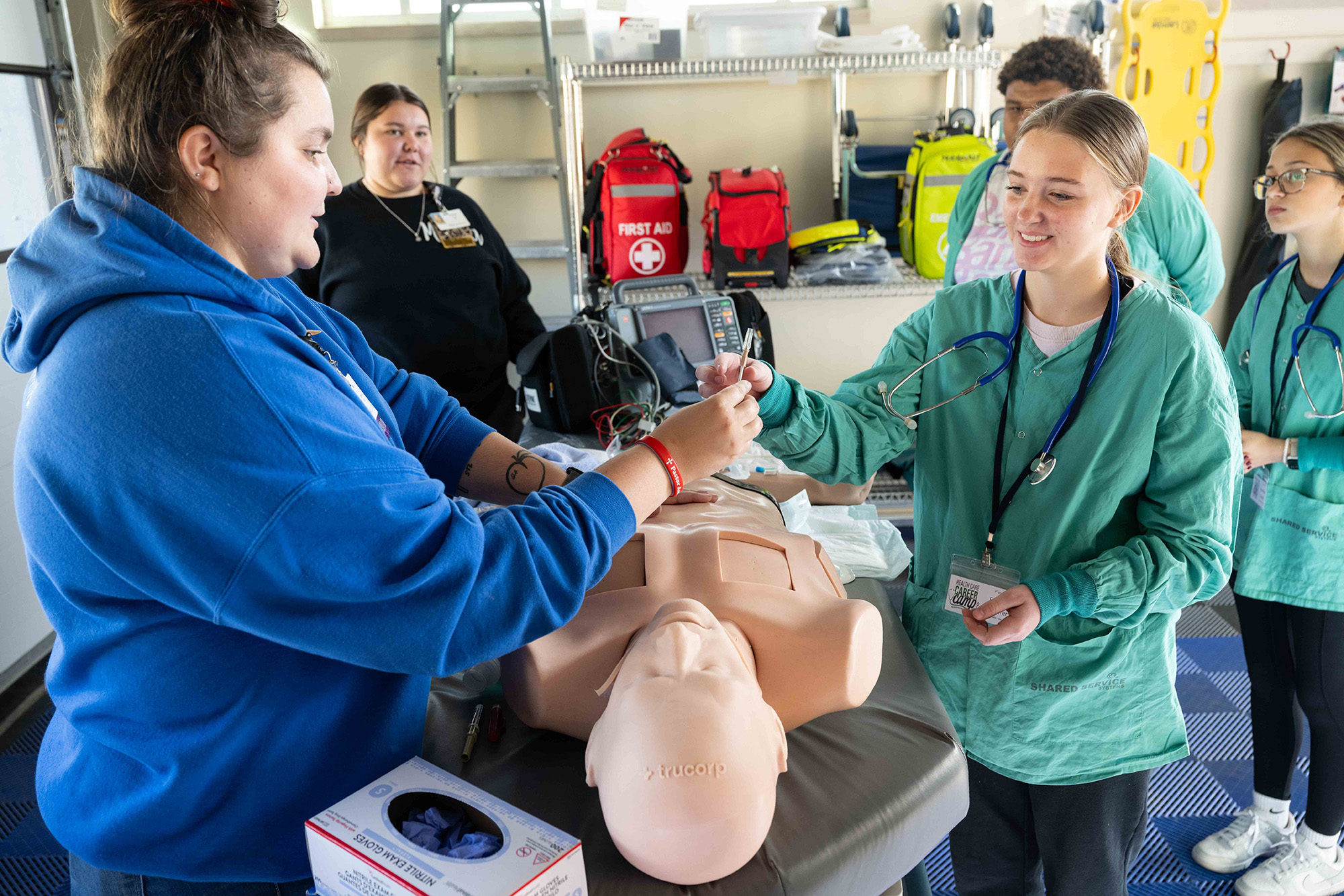 students working one of several scenarios staged at the Health Care Career Camp this fall in Manning, Iowa