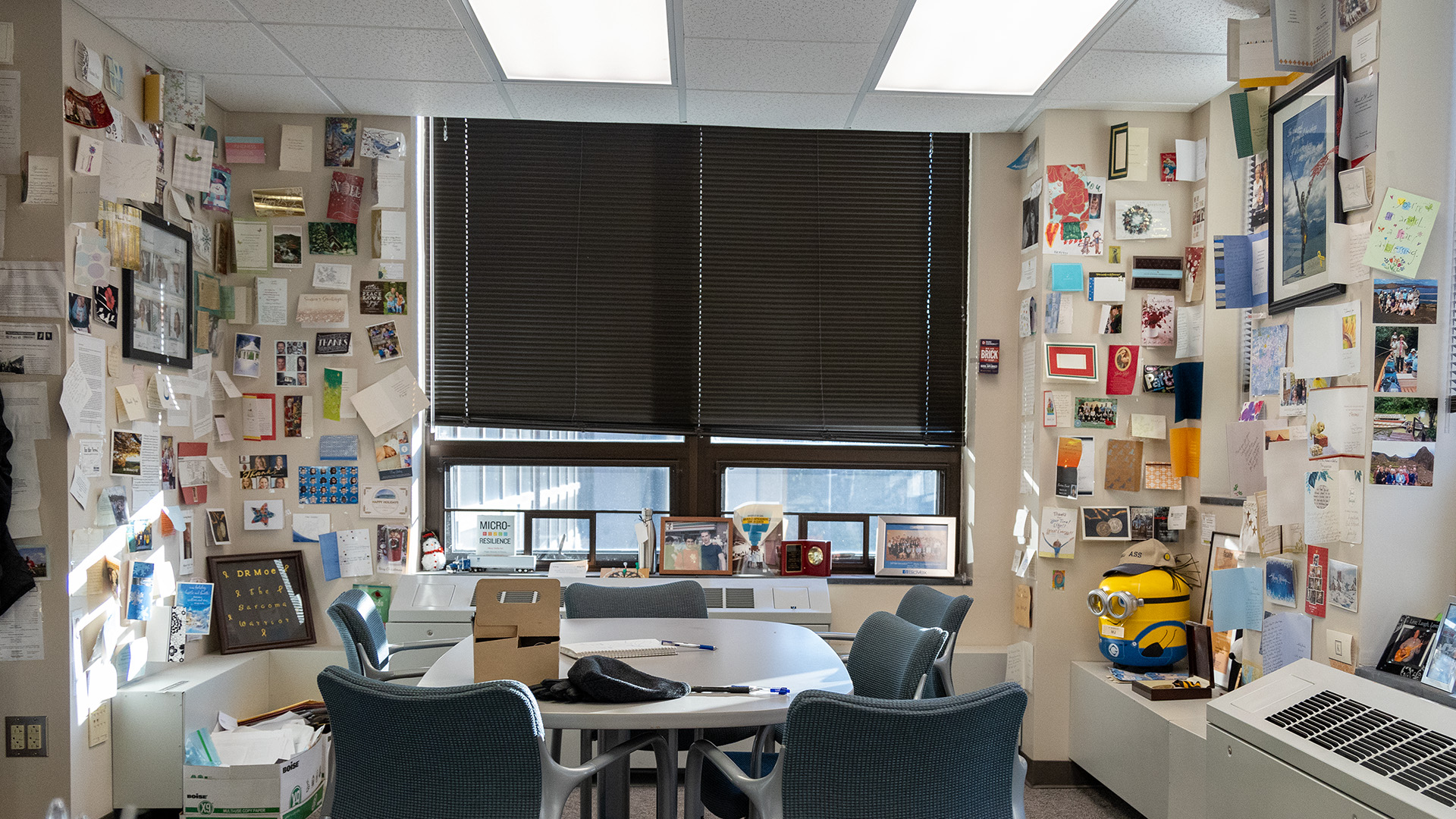 an office with thank-you letters adorning the walls