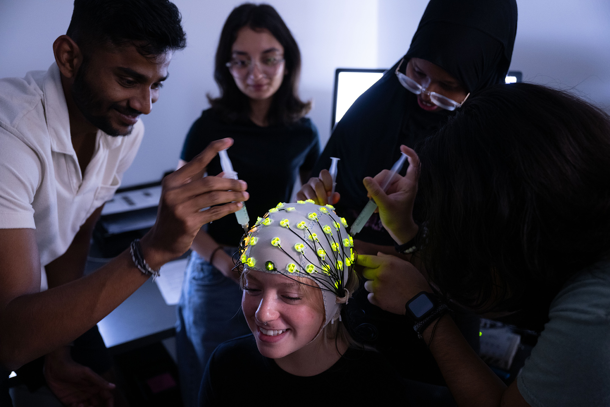 students learning techiques involved with electroencephalography (EEG)