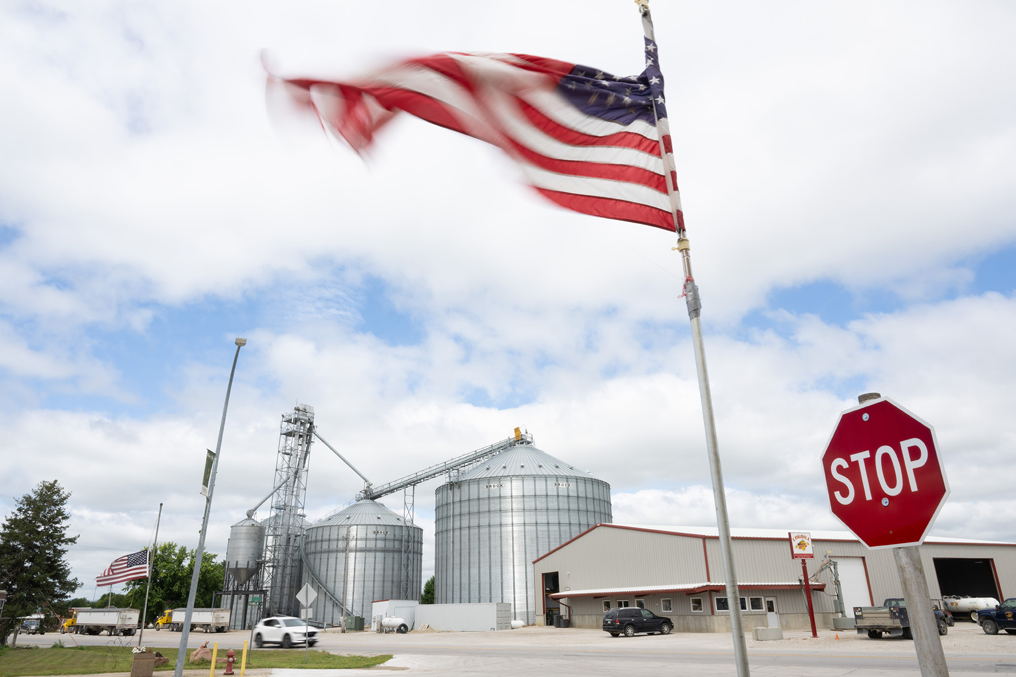 A landscape with many silos in it and a warehouse