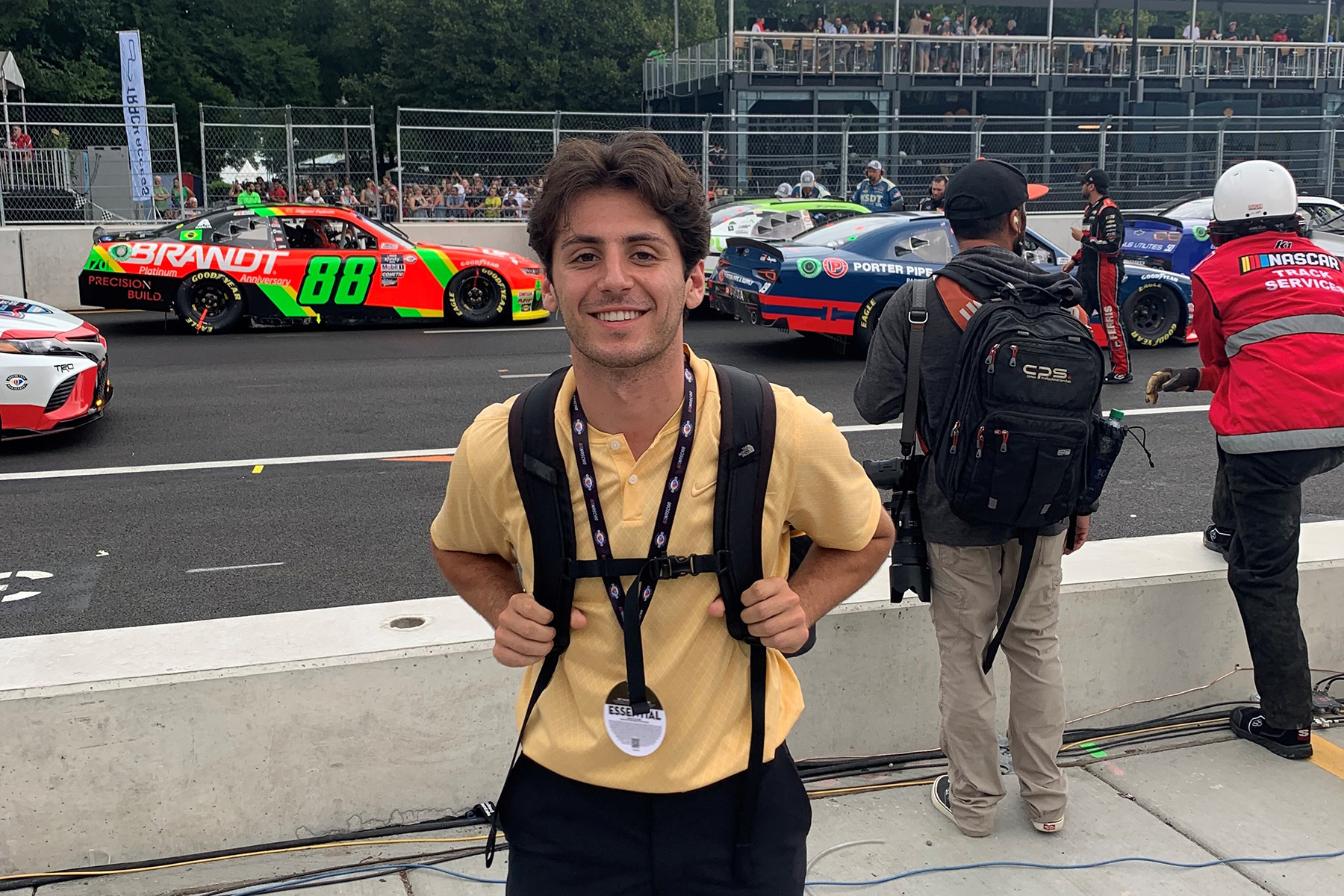 a man standing on pit row