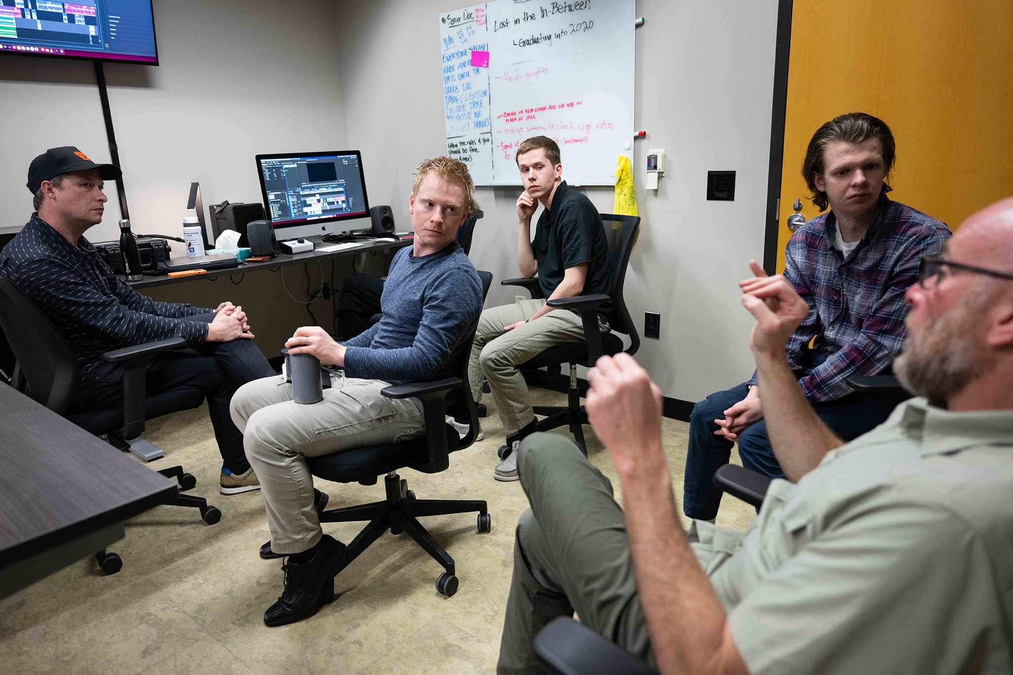 A group of people listening to an associate
