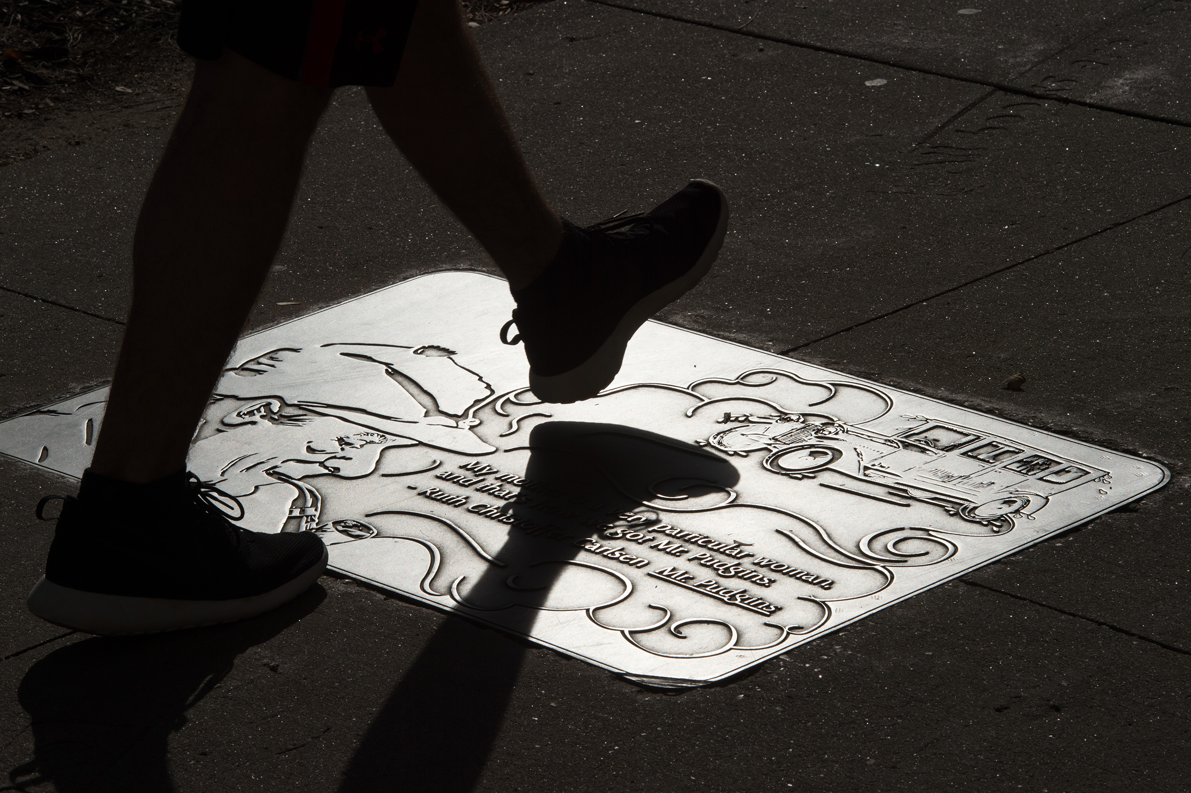 Someone taking a step on a plaque