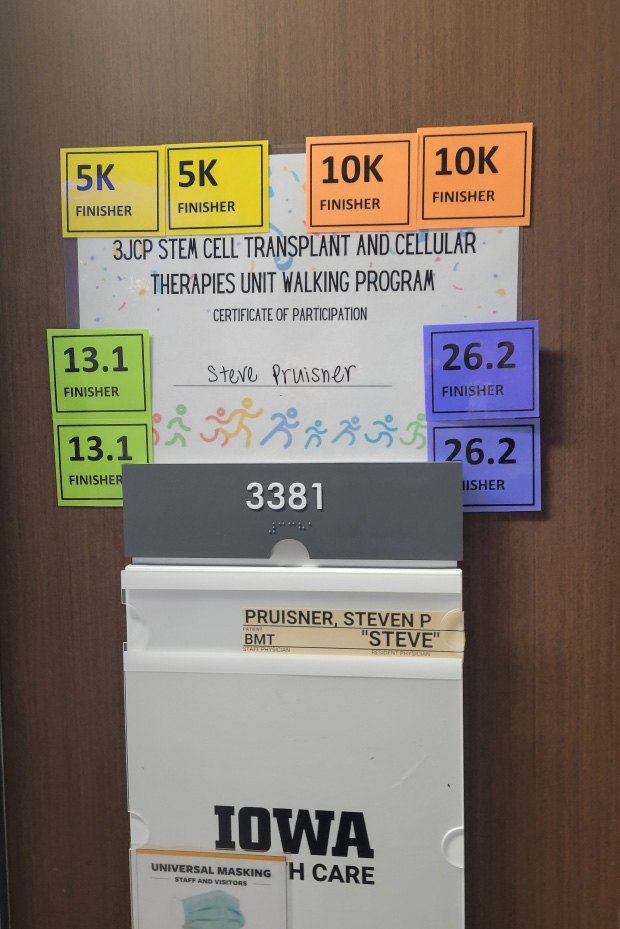 Steve Pruisner’s door featured badges that noted his walking accomplishments