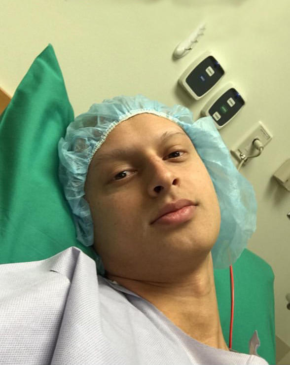 A man sitting in a hospital bed