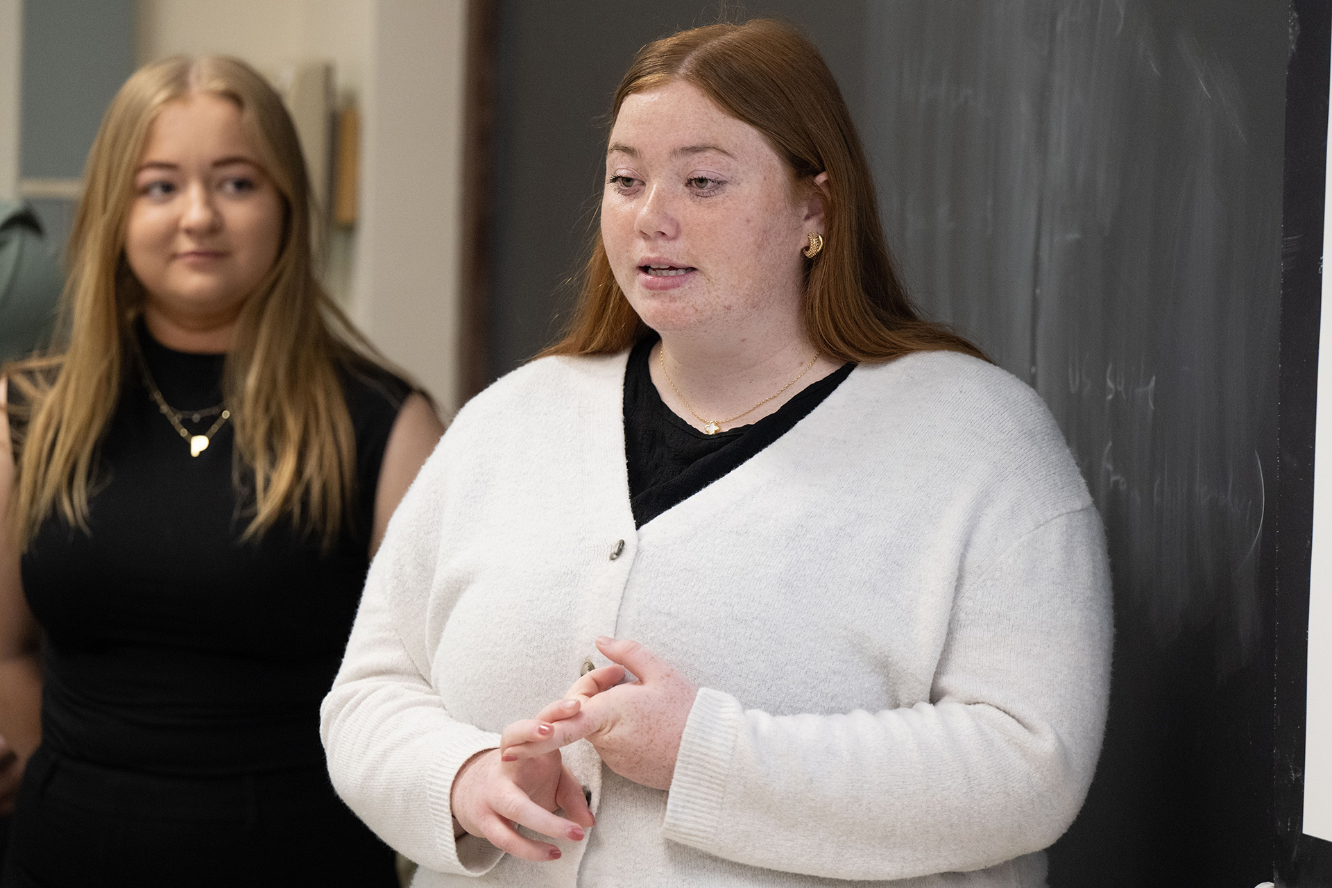 a student giving a presentation to a university of iowa student athlete