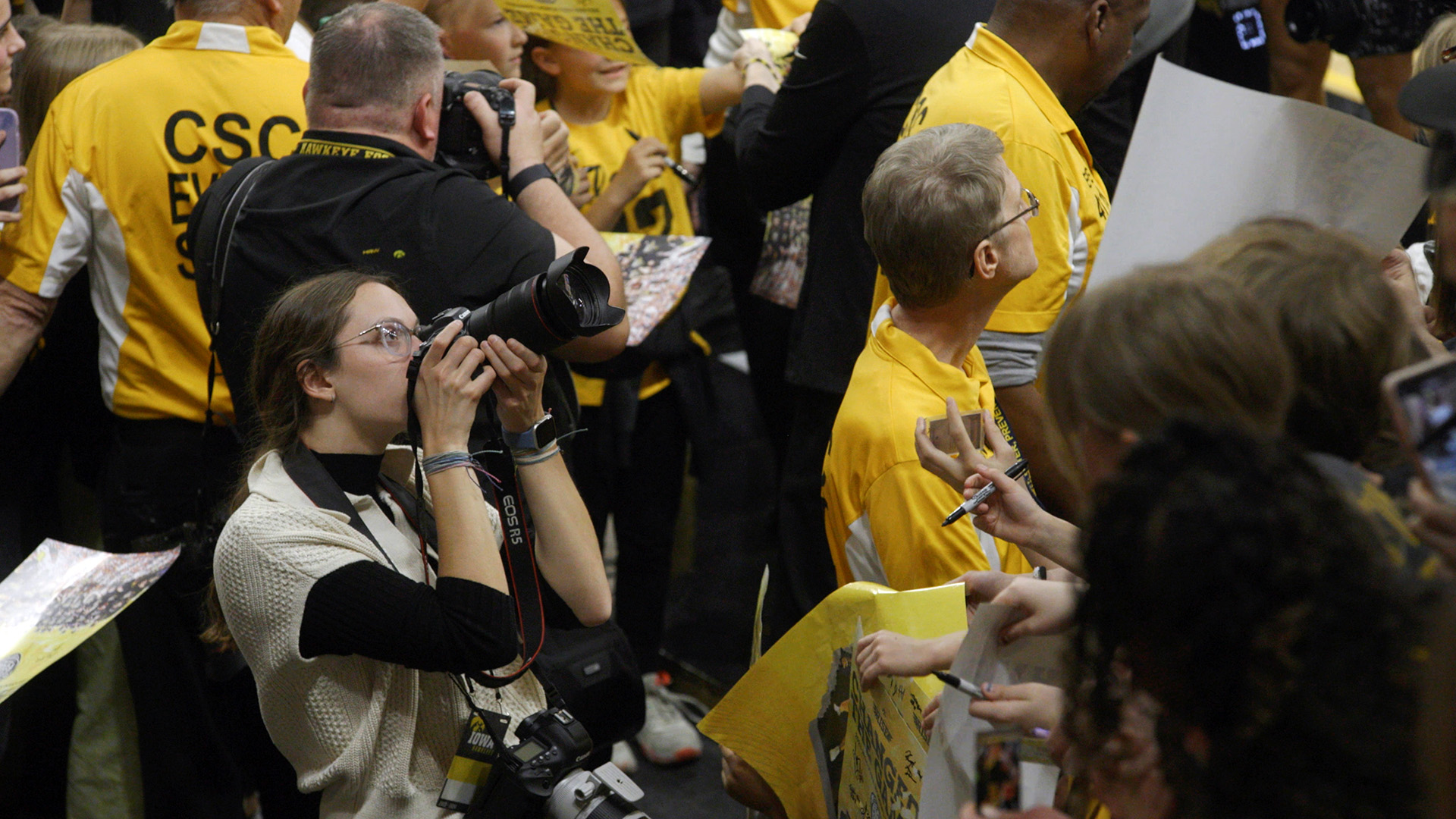 University of Iowa grad Grace Smith shooting photos at Carver-Hawkeye Arena during her days as an Iowa student