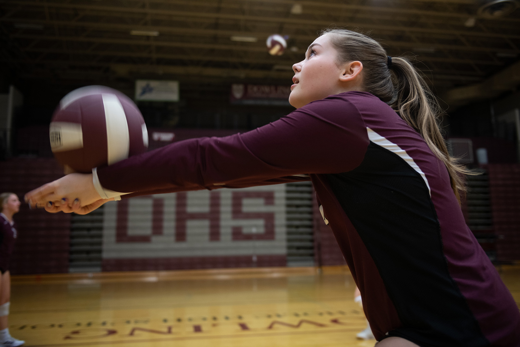 A girl receiving a volleyball