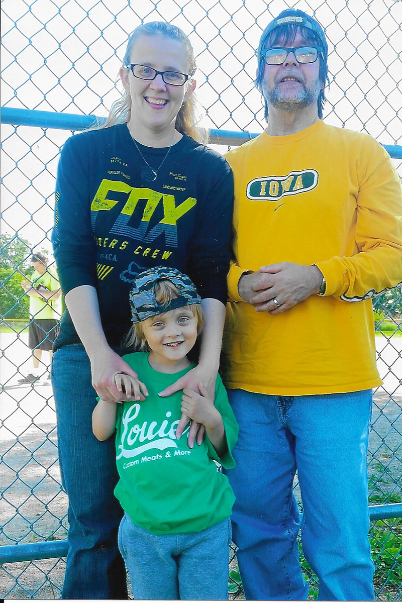 A family standing together outside