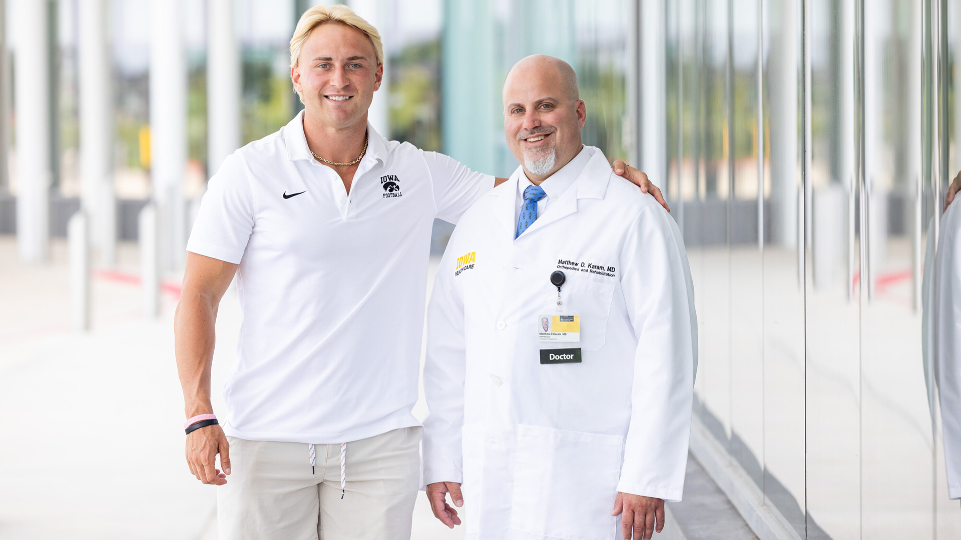 Nick Phelps stands with his doctor, Matthew Karam, on the UI Health Care campus