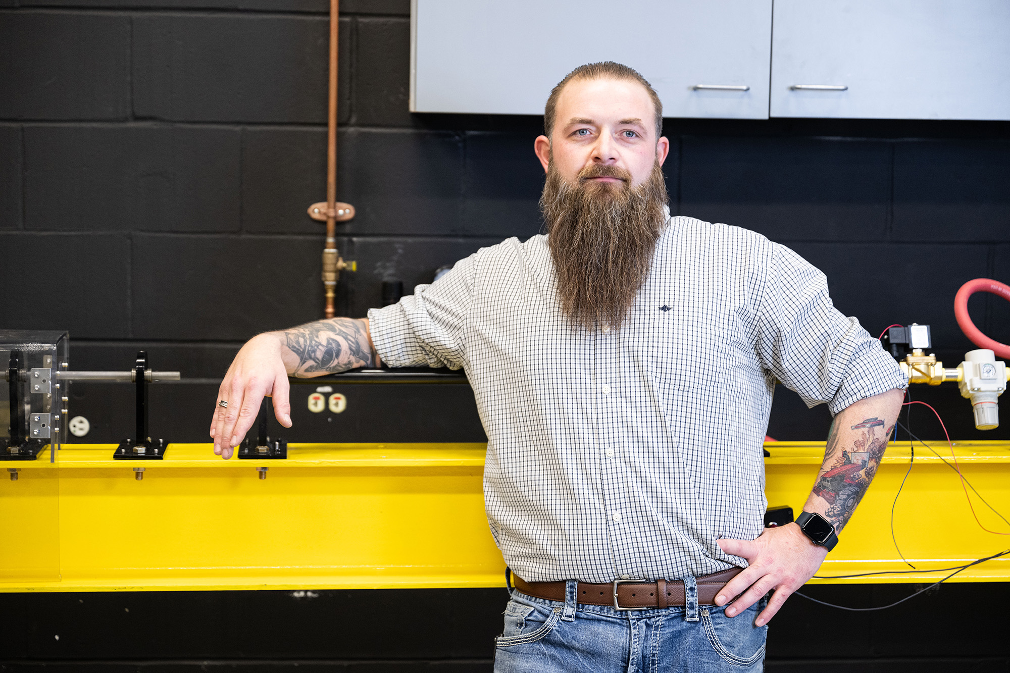 a man standing in an engineering lab