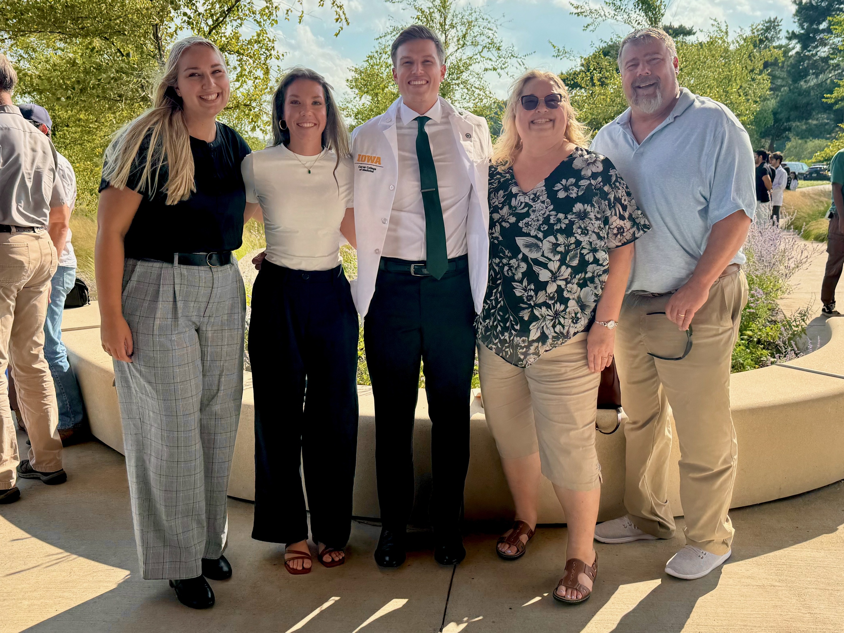 Alec Marticoff, a medical student at the University of Iowa Carver College of Medicine, celebrates with his family at the annual white coat ceremony.