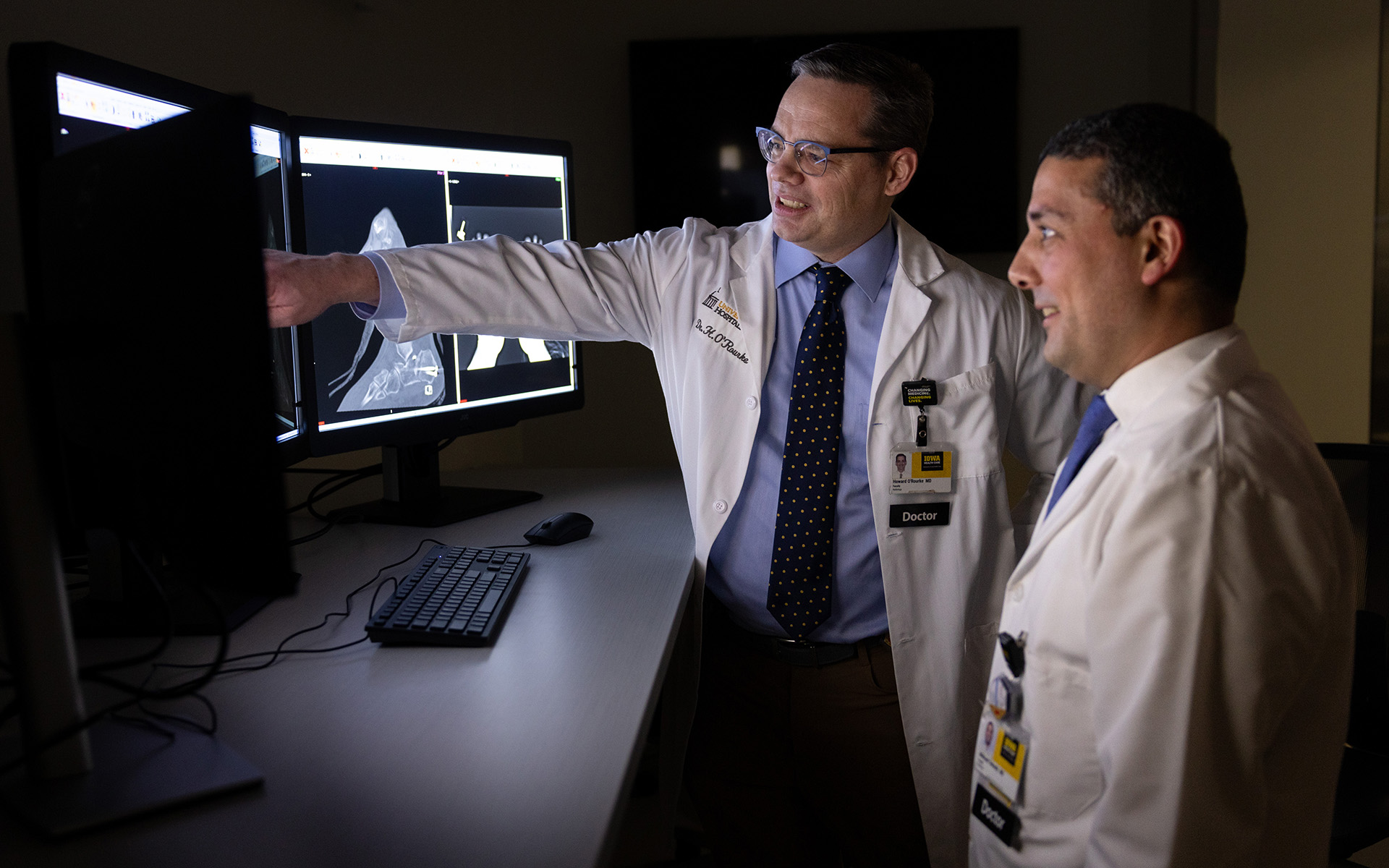 Department of Radiology faculty members looking at computer screens