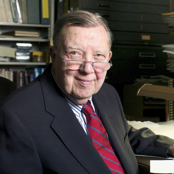 James Van Allen sitting at his desk