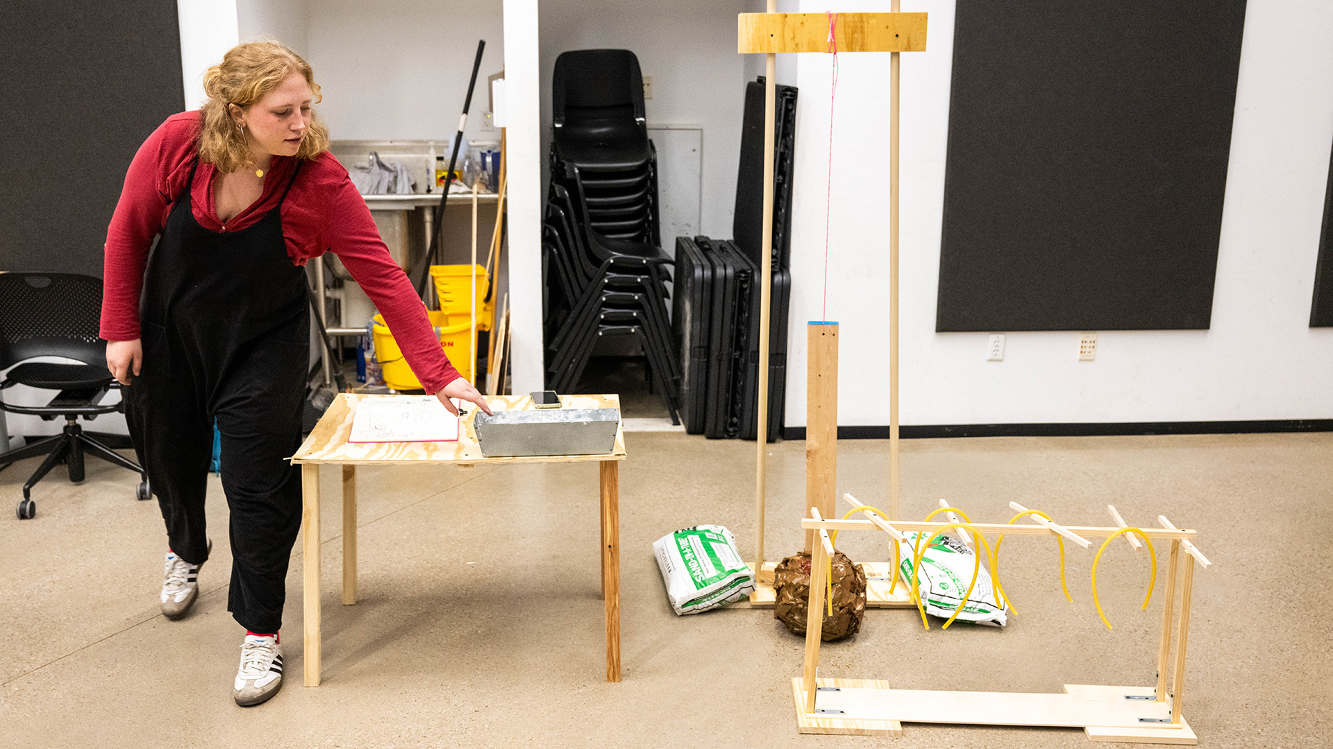 a student works on an artistic design in a studio classroom