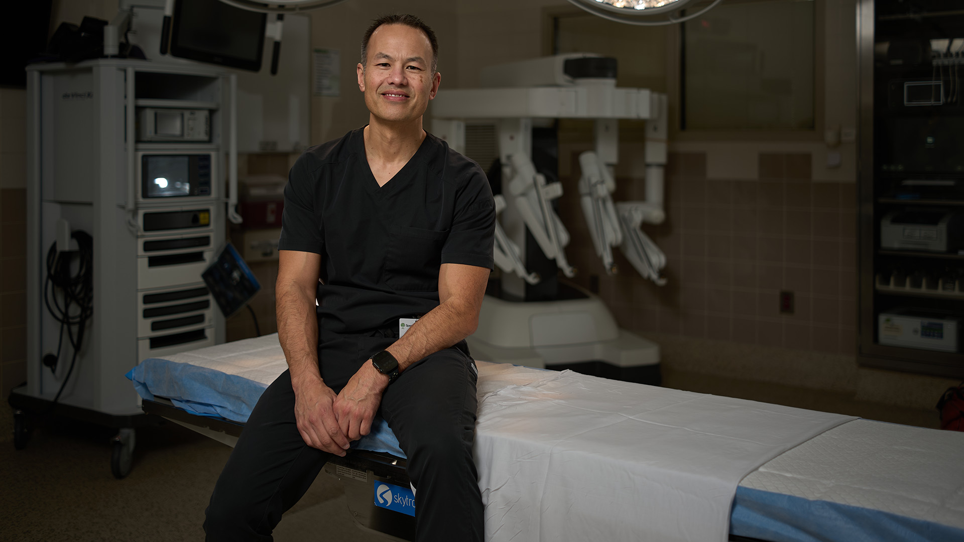 a surgeon stands in an operating room
