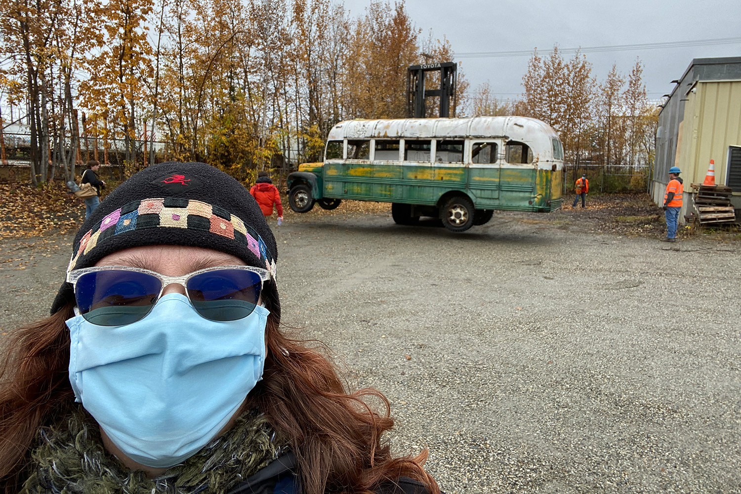 University of Iowa alumna Angela Linn with the "Into the Wild" bus in the background