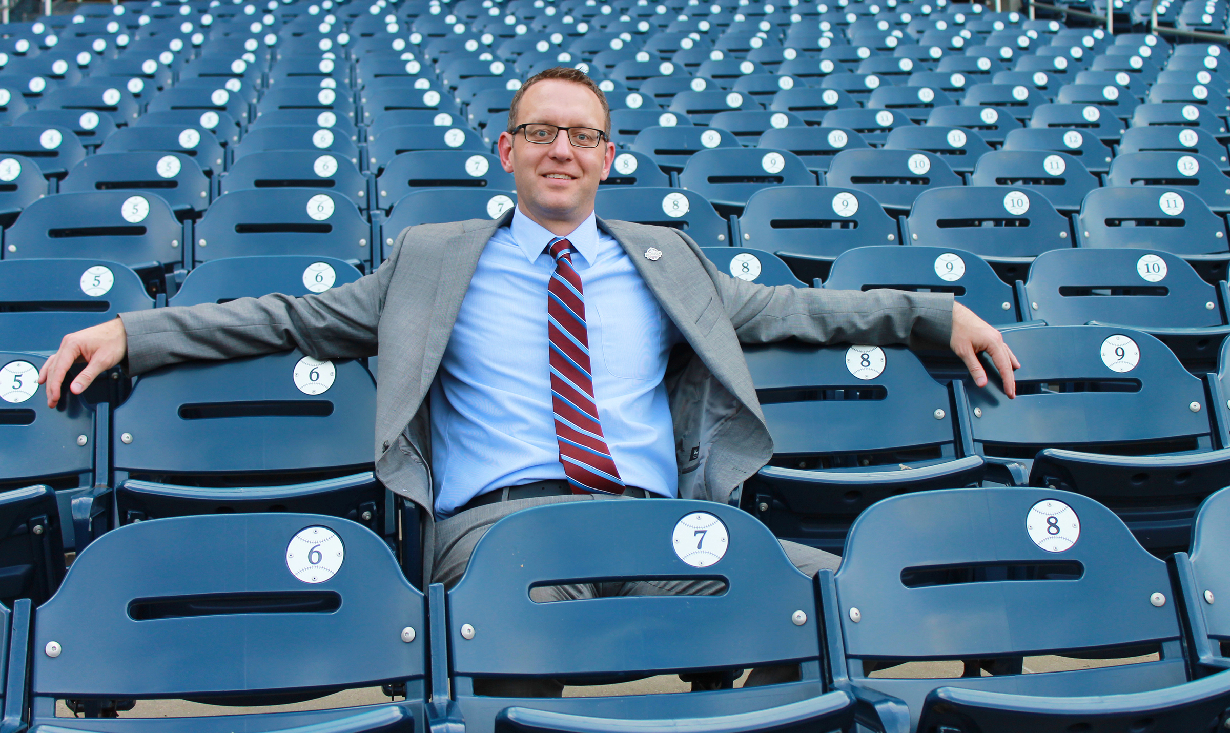 UI alumnus Joe Dwello sitting in seats at Washington Nationals ballpark