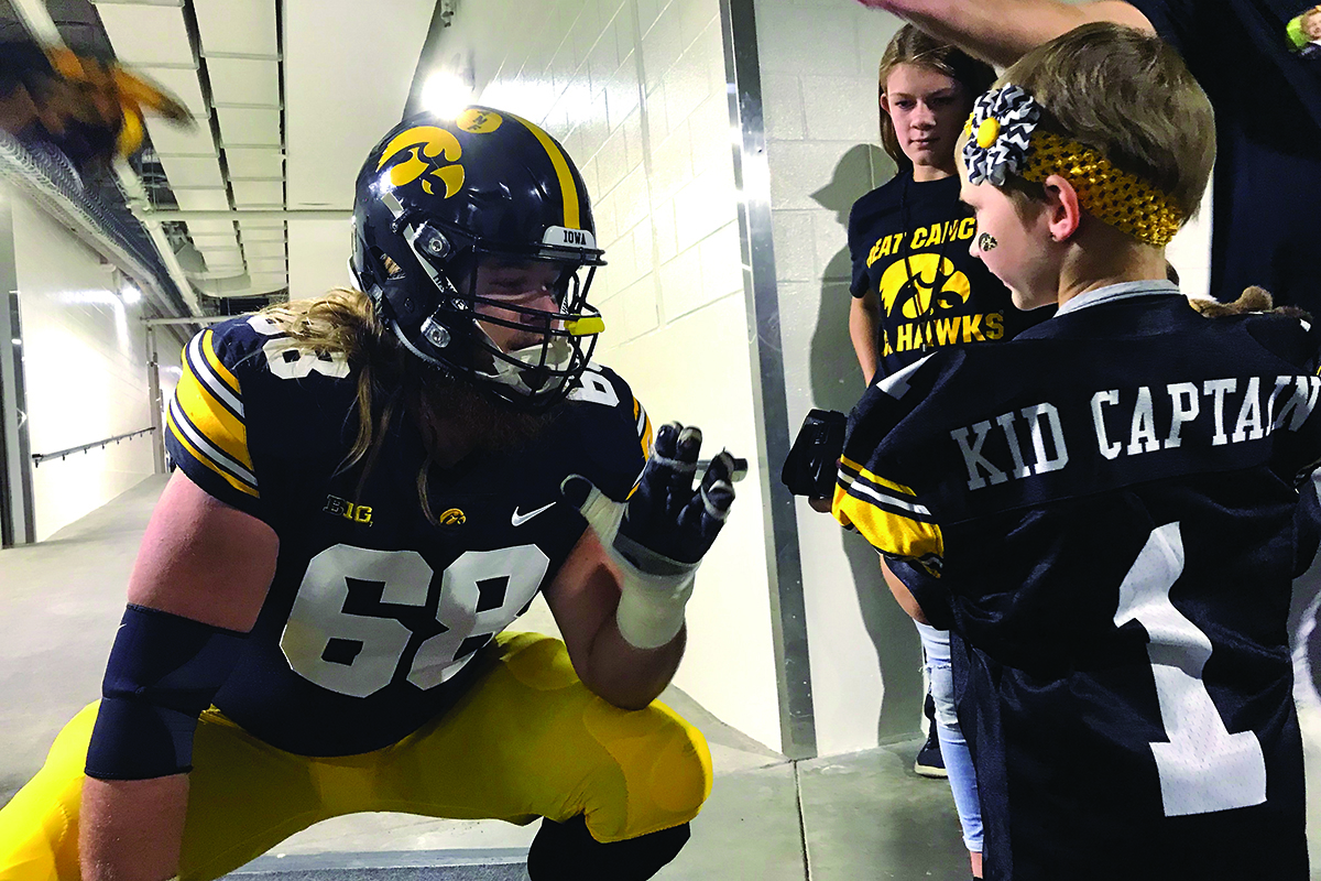 university of iowa football player and kid captain honoree