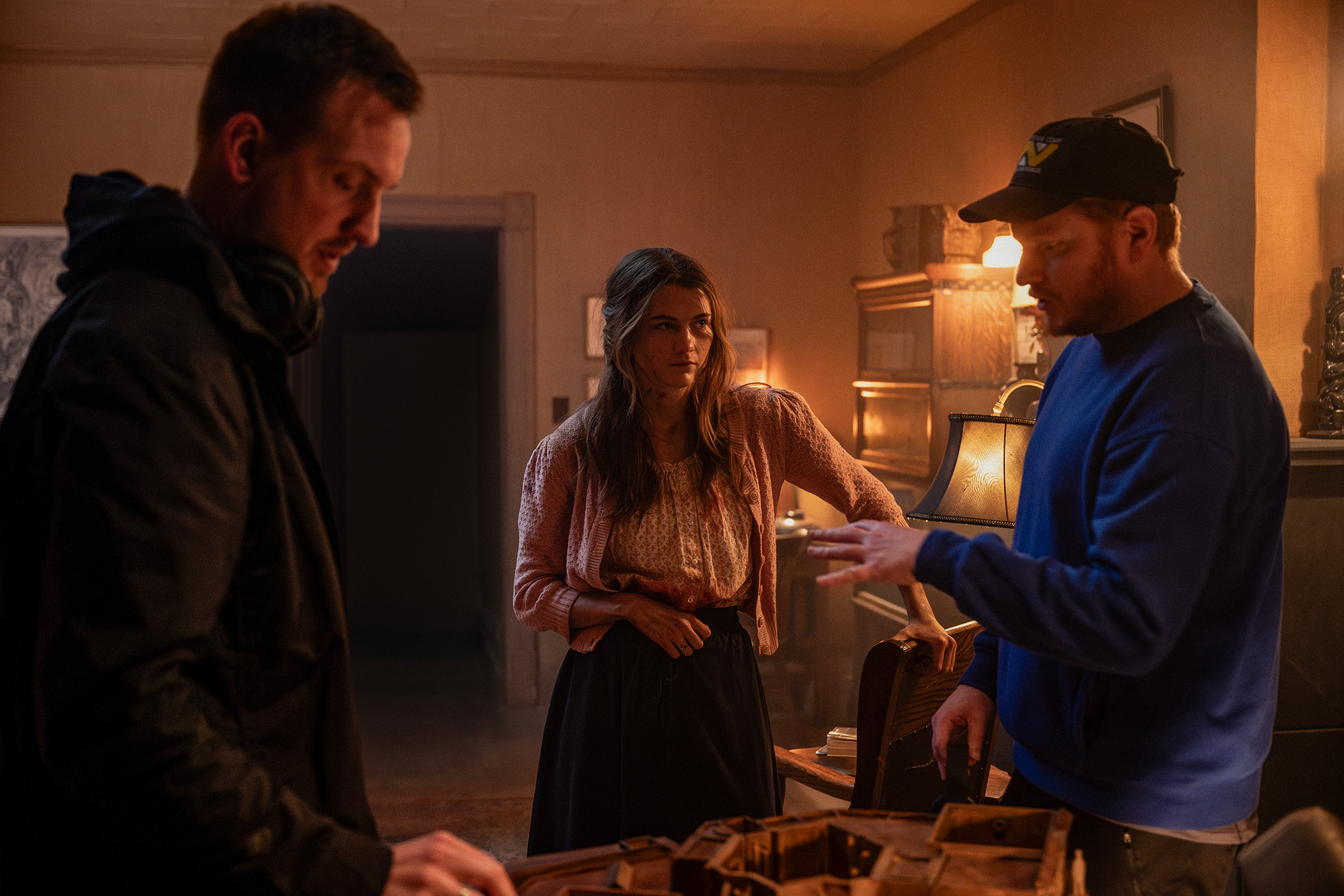 Scott Beck, Chloe East, and Bryan Woods on the set of Heretic