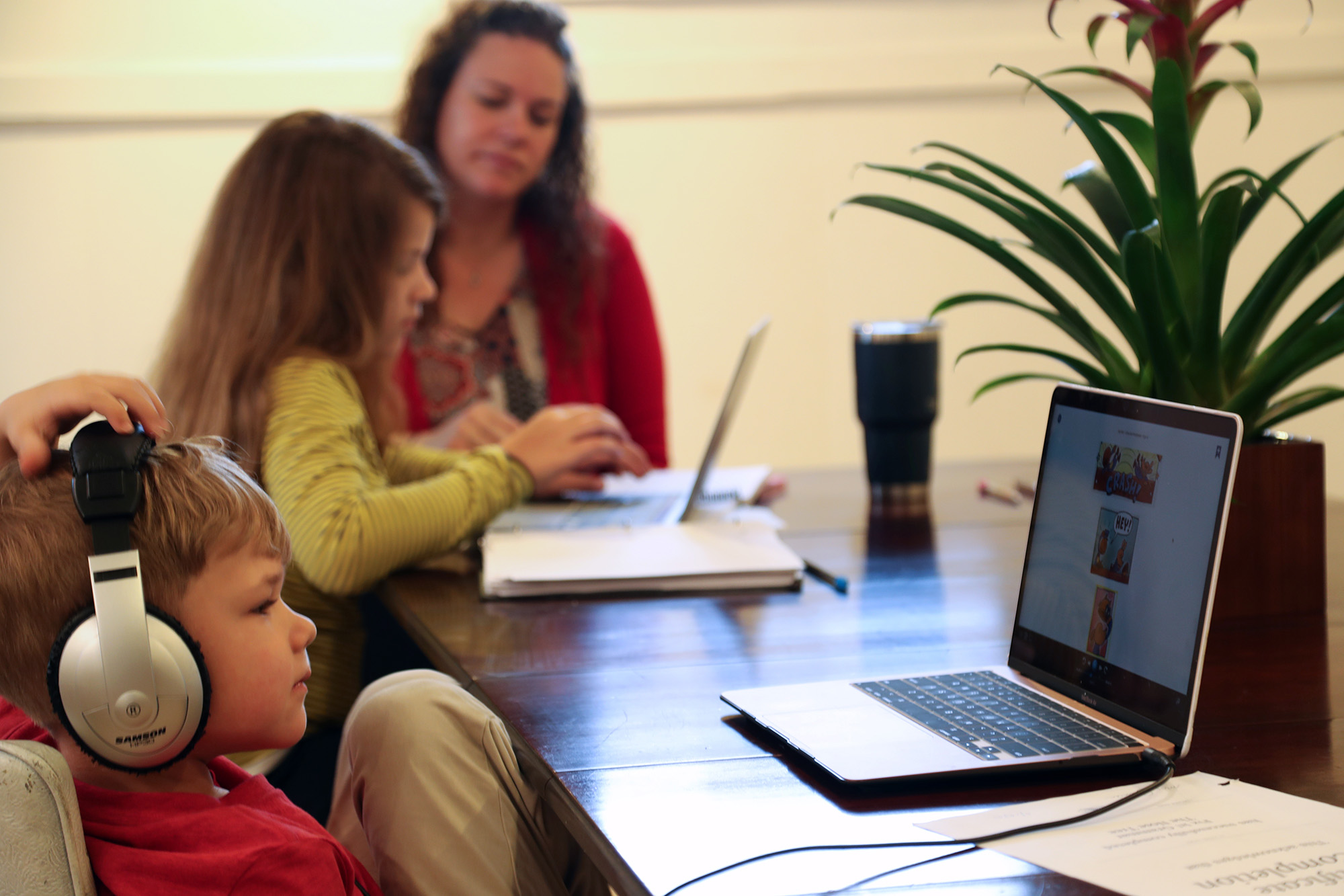 The VanZuiden family of Williamsburg, Iowa, using assistive technology