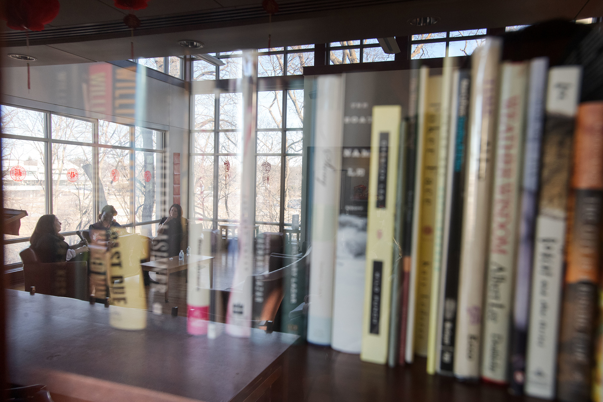 books on a shelf in the Dey House, home of the iowa writers' workshop