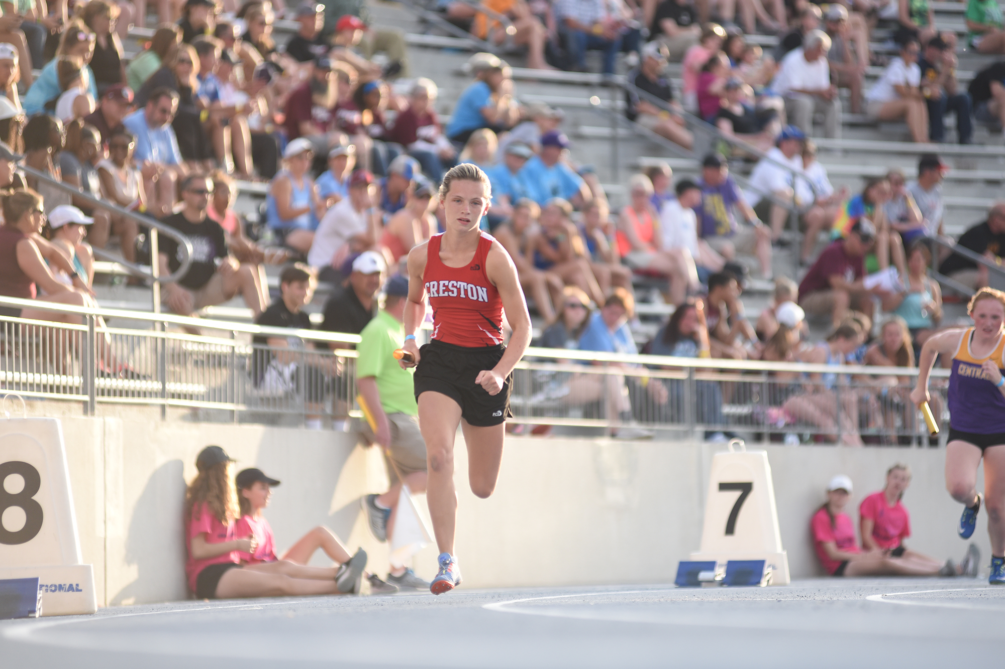 Kiersten Latham runs at the Iowa State Track Meet during her days at Creston High School