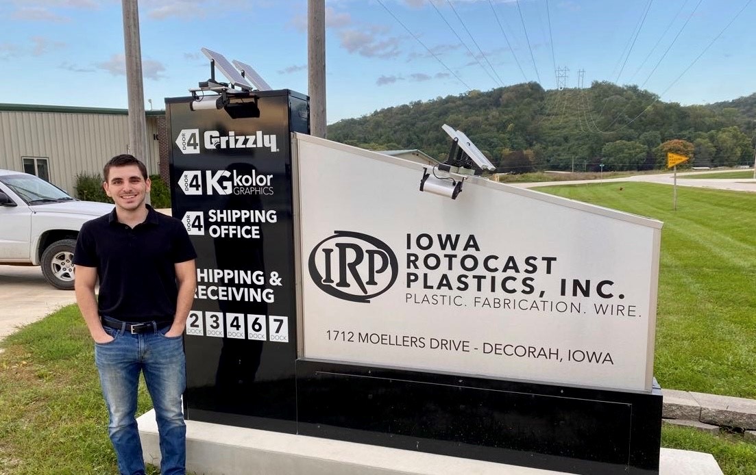 University of Iowa alumnus Max Swartz standing outside of Iowa Rotocast in Decorah, Iowa