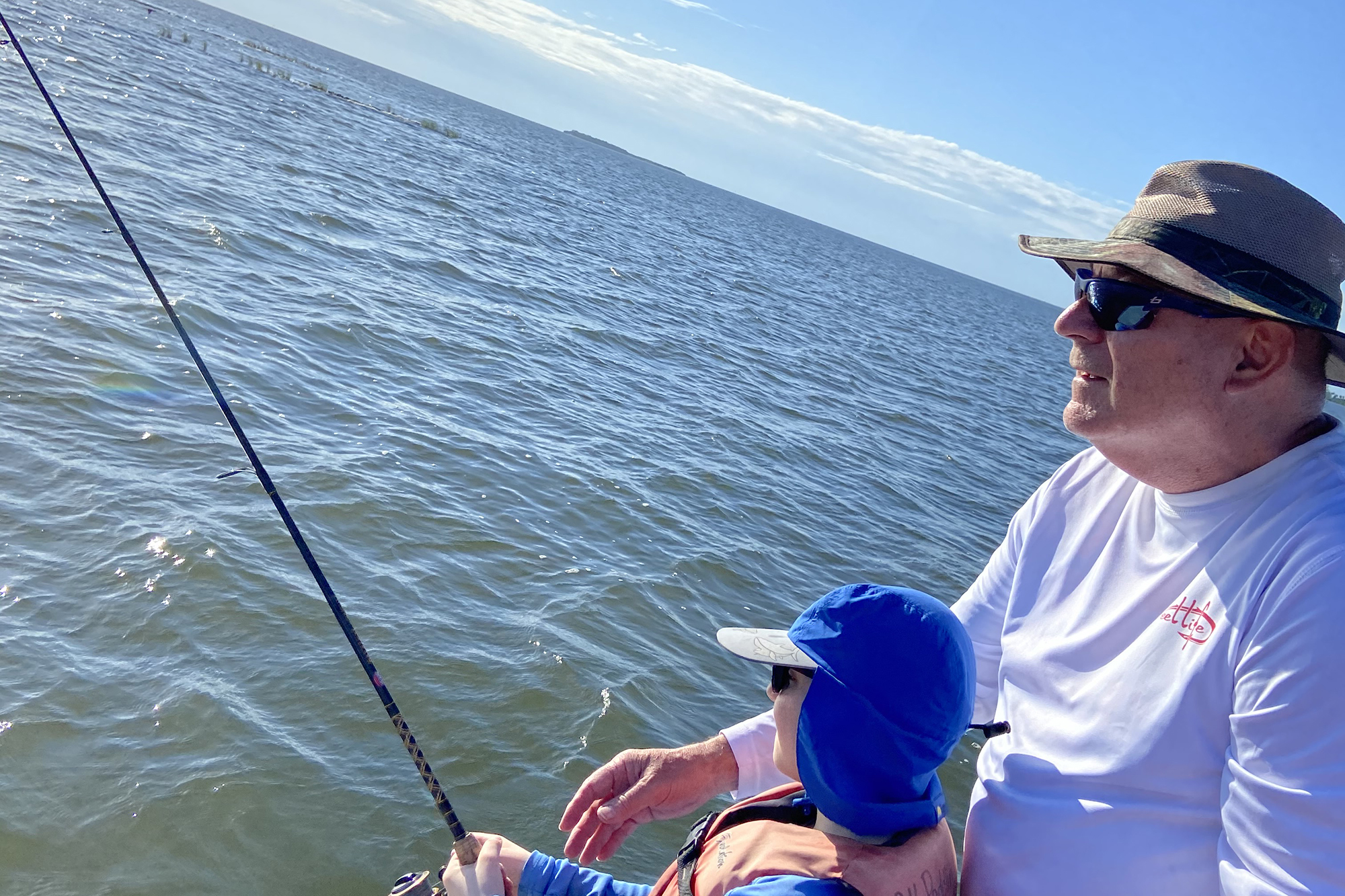Owen Shunkwiler fishing with his grandchild