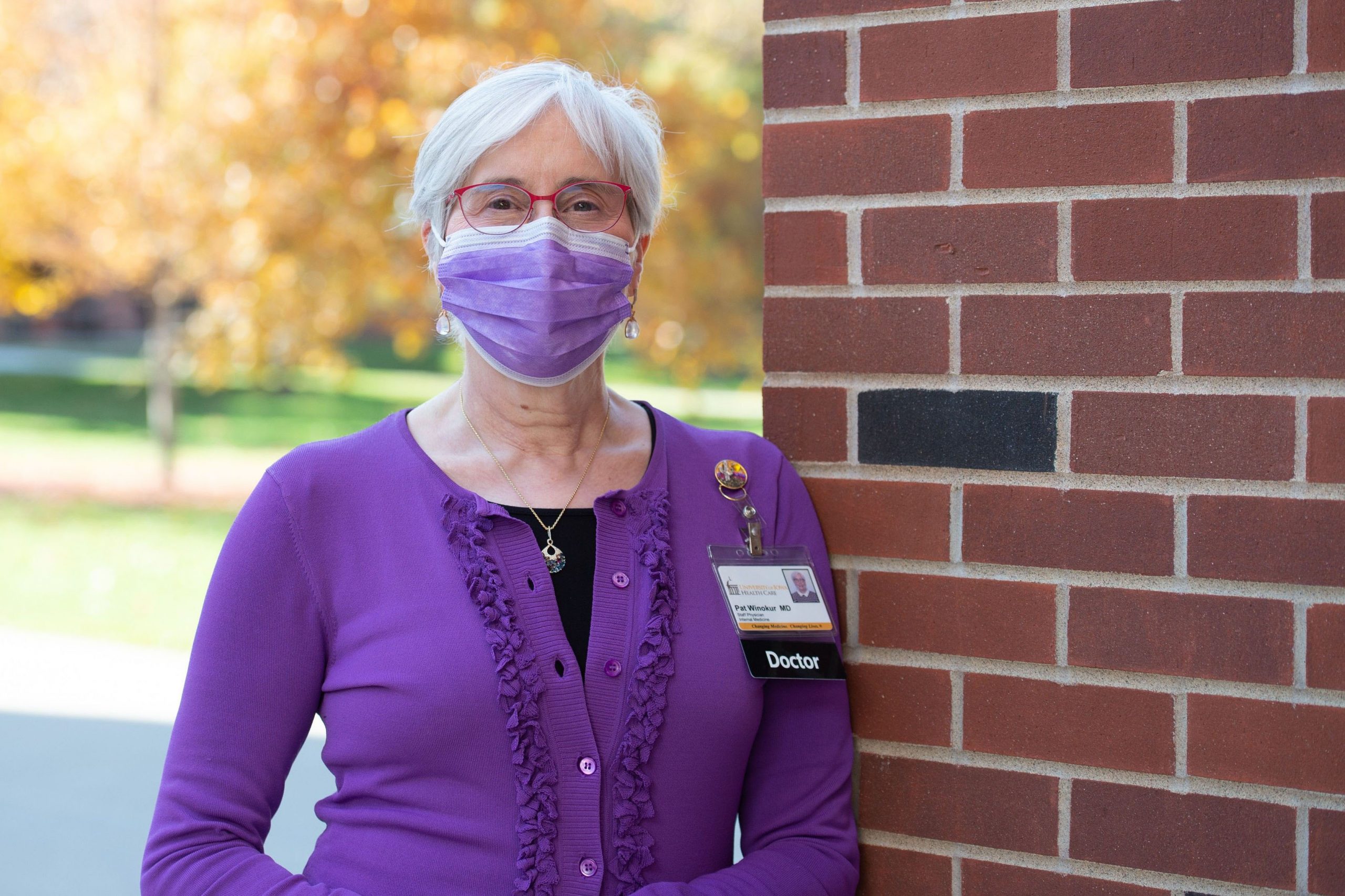 Pat Winokur, MD, executive dean of the University of Iowa Carver College of Medicine, standing outdoors, wearing face mask