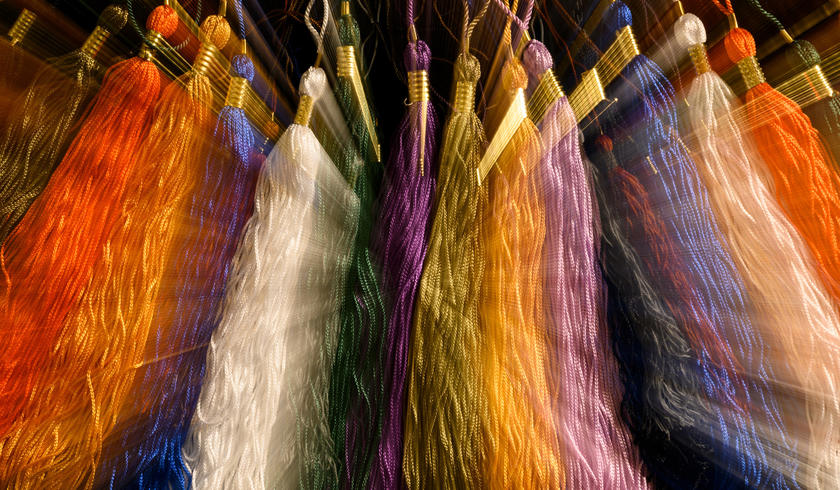 Multiple colored tassels in a row