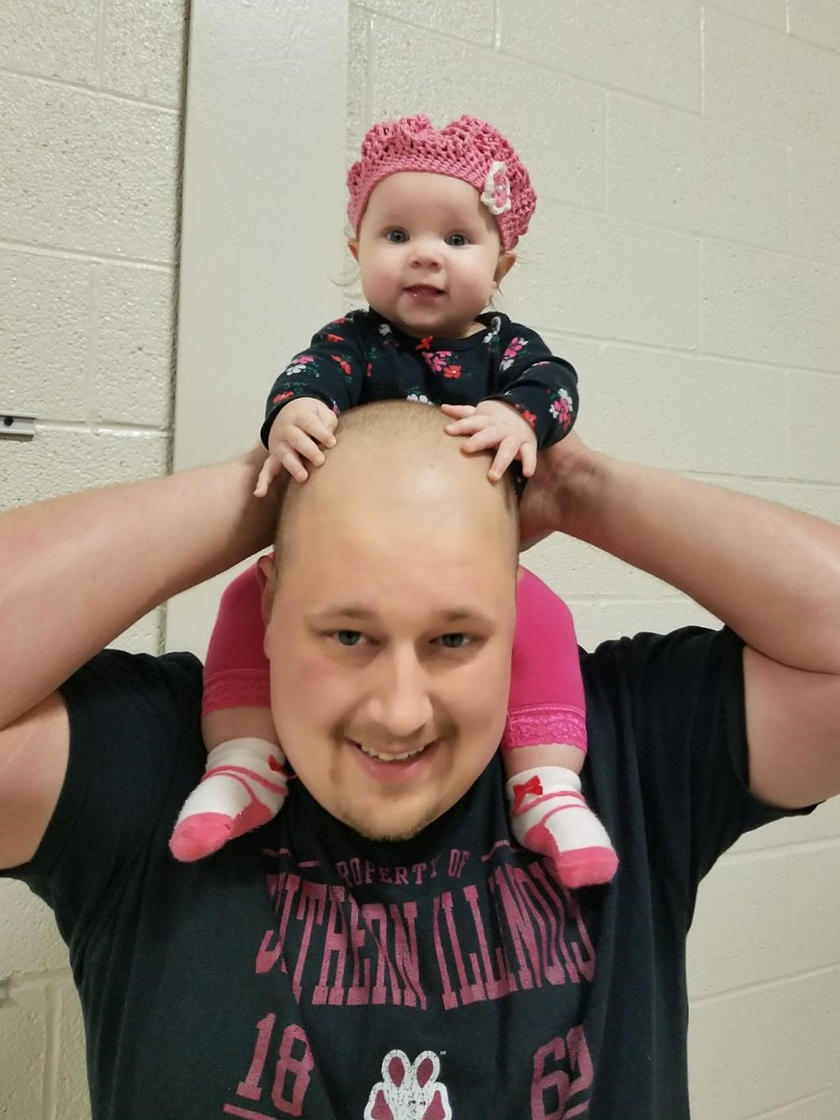Chris Ferenzi with his daughter on his shoulders