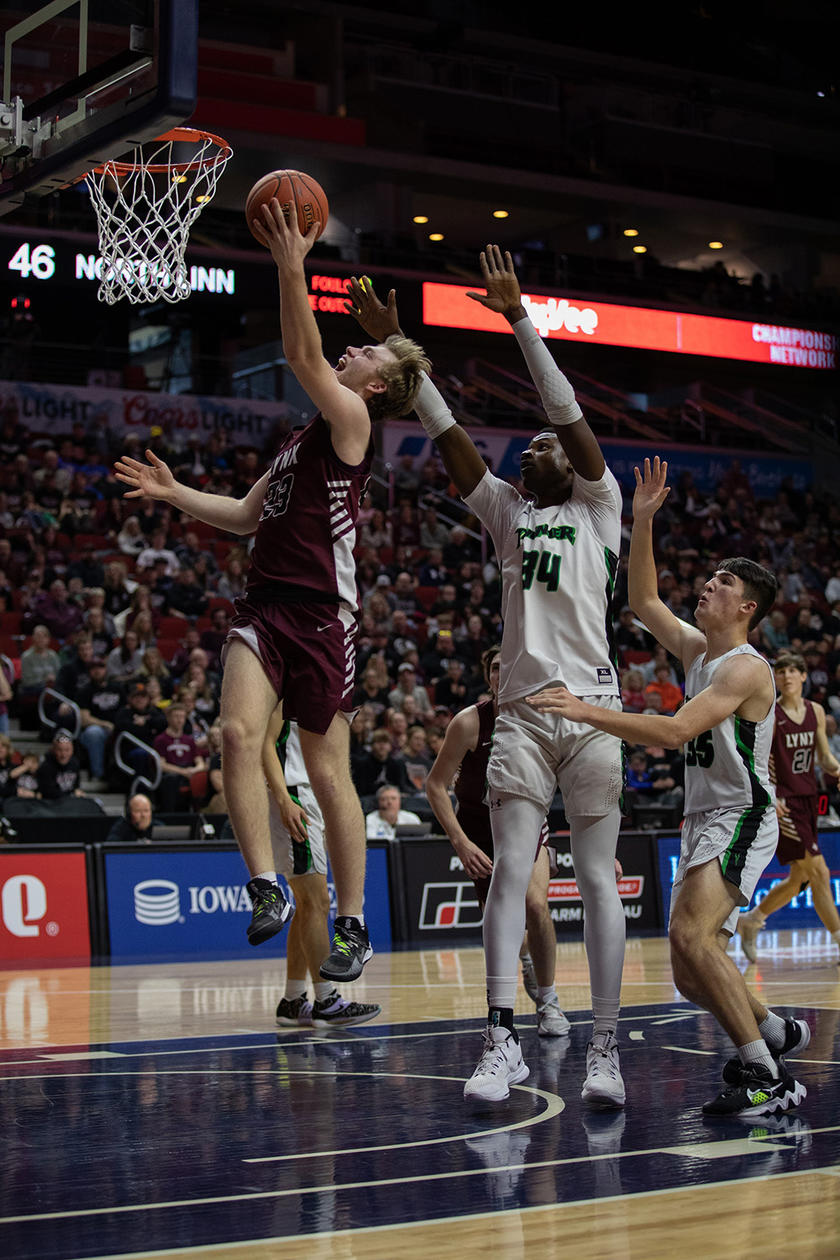 North Linn student Dylan Kurt drives to the hoop during the state basketball tournament
