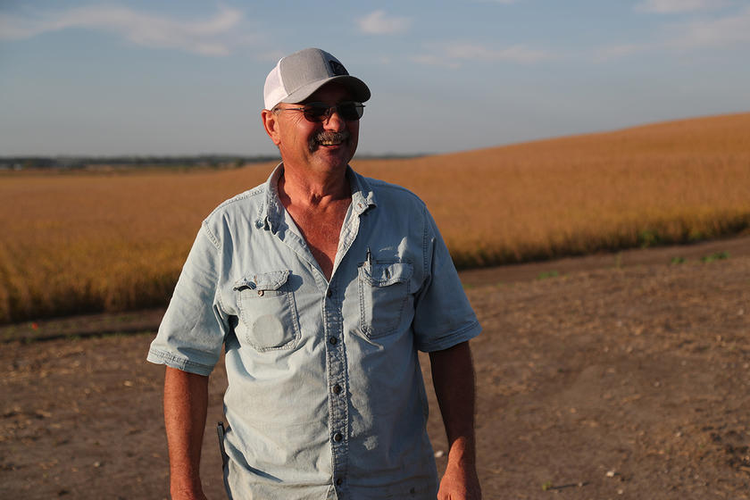 a man standing in a rural setting