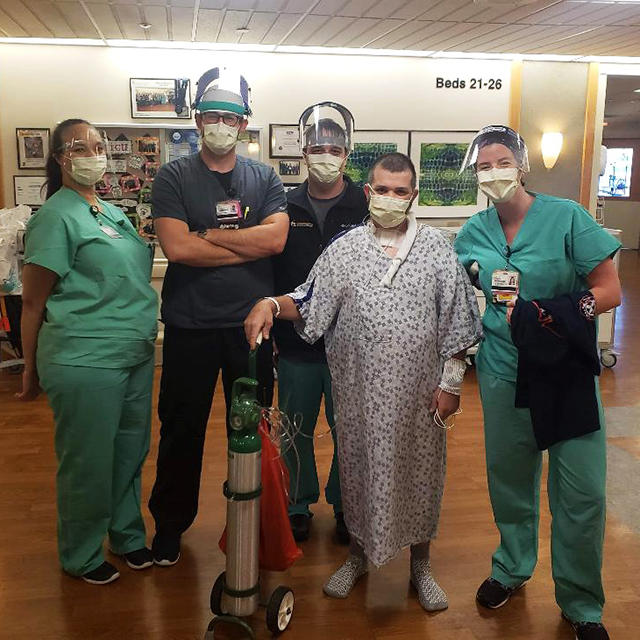 Paul Sereda standing with members of the intensive care unit staff