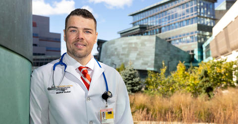 University of Iowa Carver College of Medicine student Joseph McDonell stands outside on the health care campus